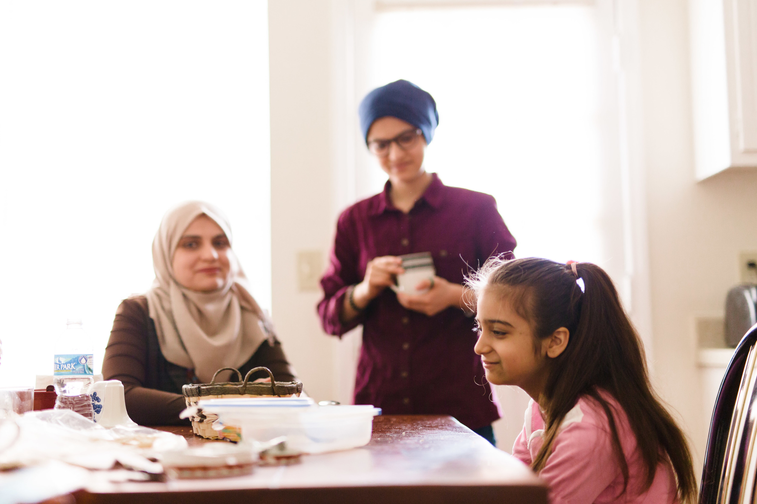 Lama, Lamis and Aya eat lunch at their new home in Durham among friends (who declined to be photographed).