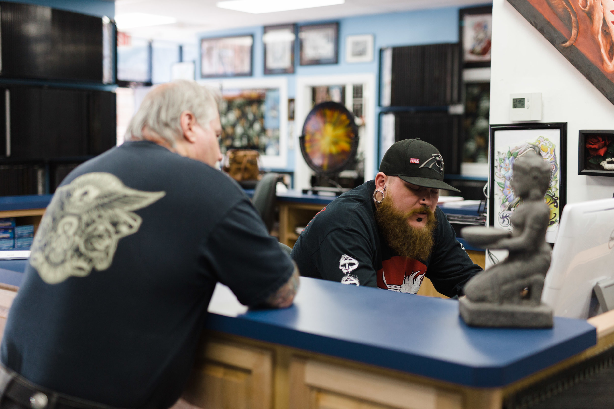 Shop-owner, Byron (left) and "gatekeeper"," Alex