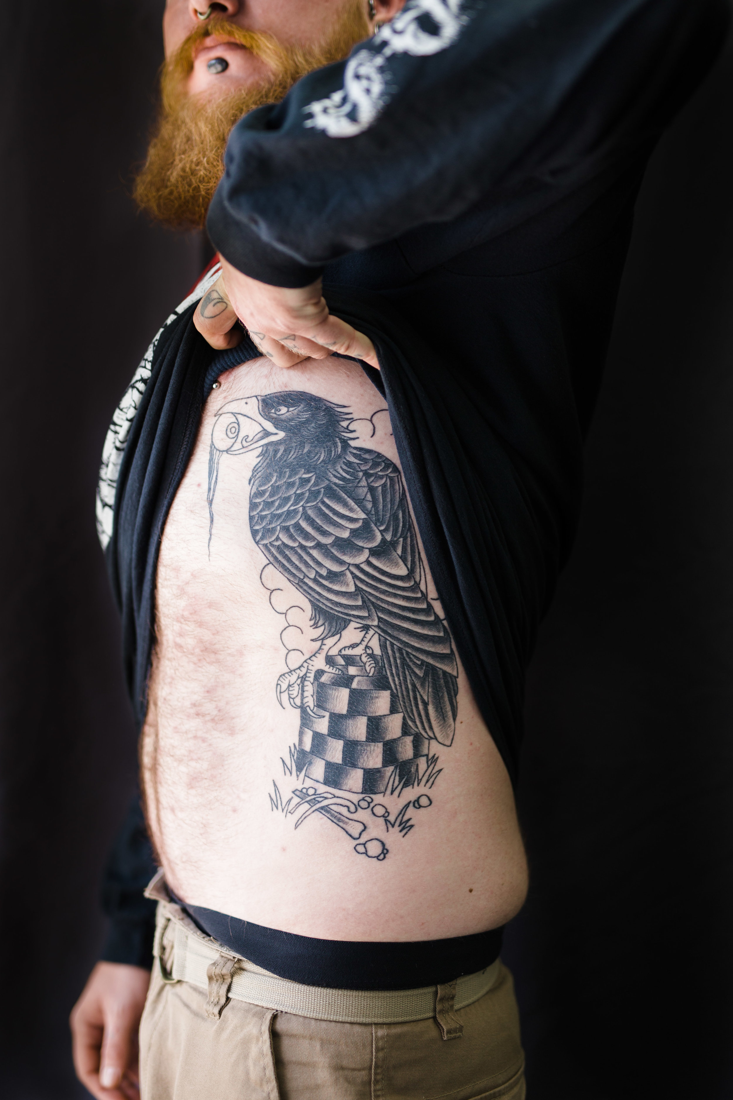 Alex displays his newest piece of artwork, a set of ravens that reference the god Odin in Norse Mythology