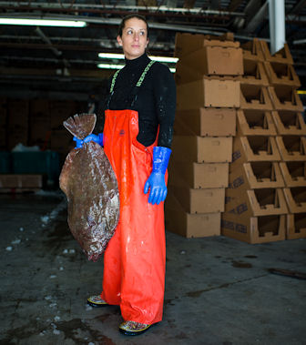 MICAH DANIELS CONTINUES A FAMILY TRADITION AT THE WANCHESE FISH COMPANY IN DARE COUNTY, A COMPANY THAT SPANS GENERATIONS. PHOTO BY DANIEL PULLEN.