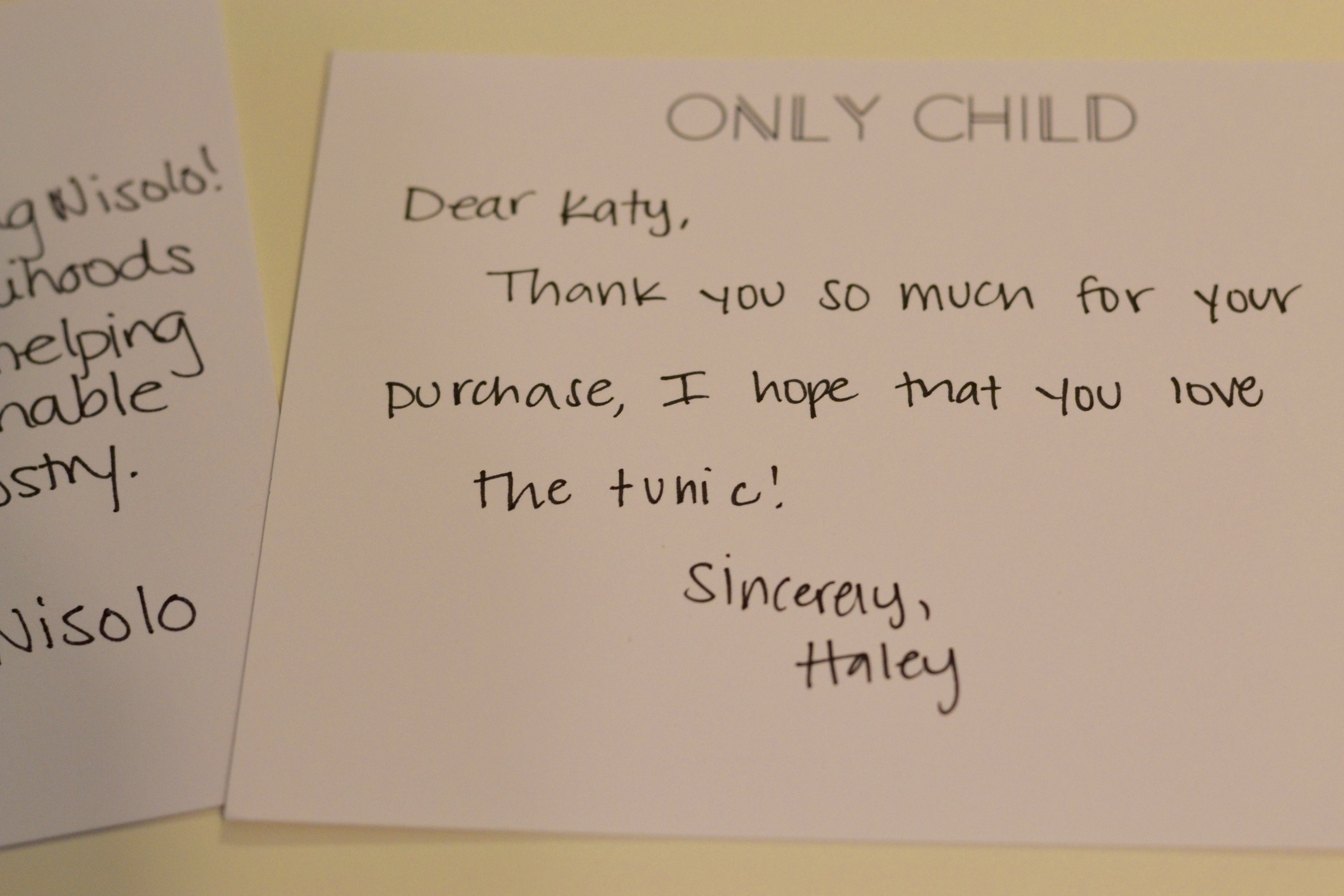 Katy saves the handwritten notes that often accompany purchases from a fair-trade company. 
