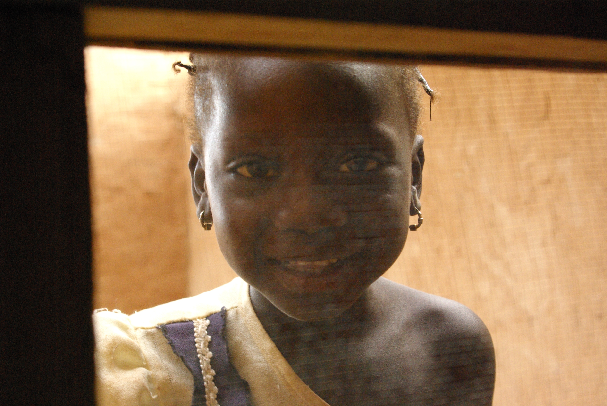 bogoya girl behind screen.JPG