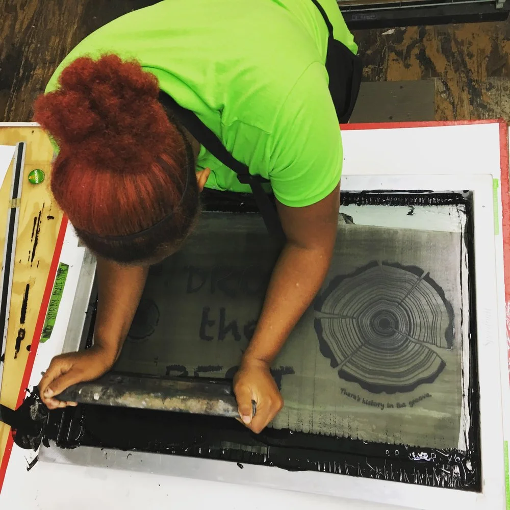 Printing her first posters.