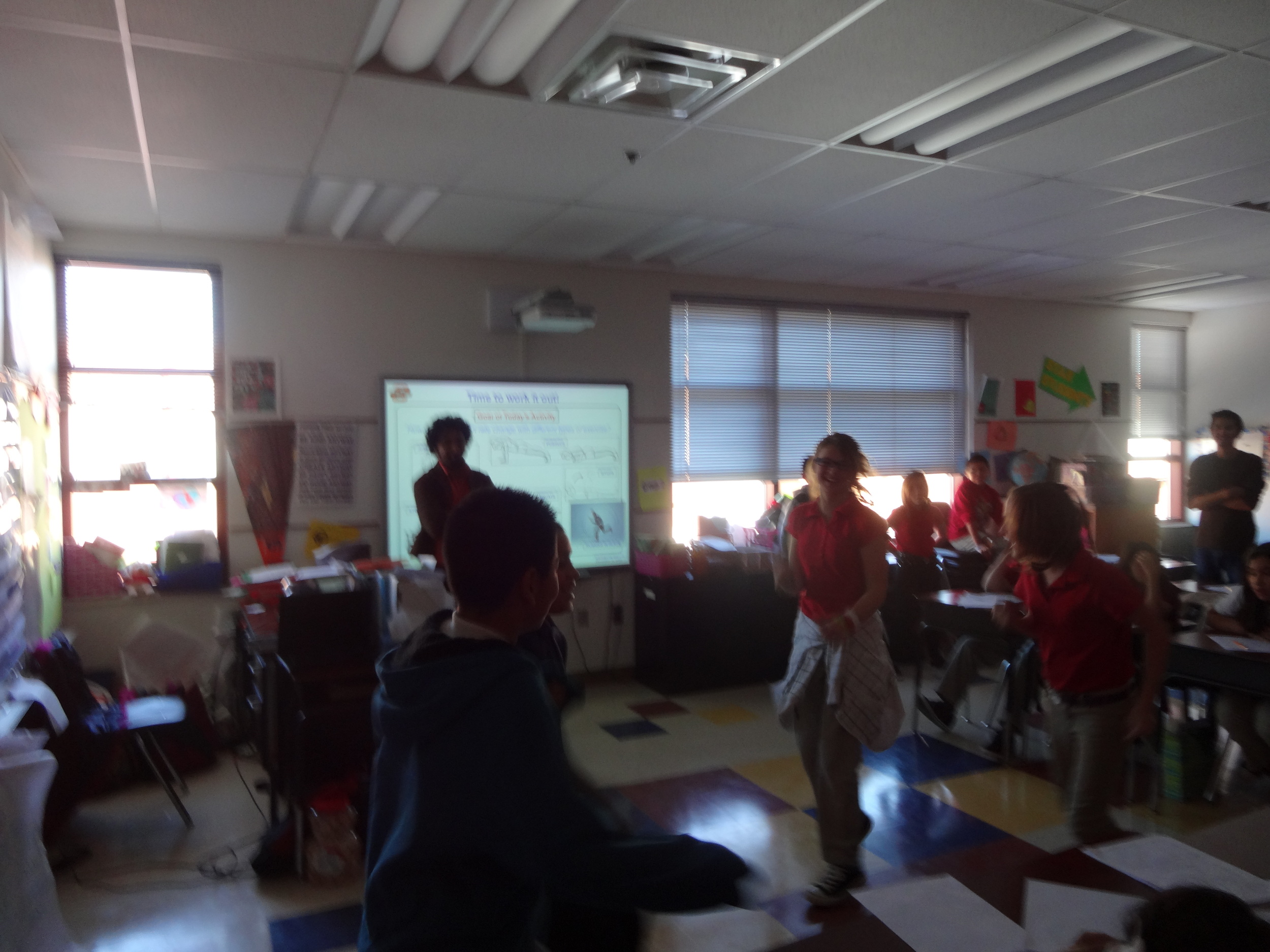 Student groups performing exercise activities - slightly chaotic!