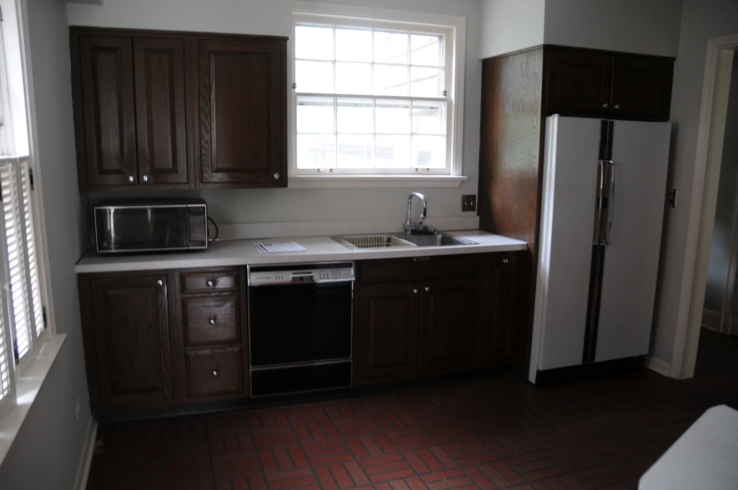 Half the original kitchen. Old, dark, and tiny. 