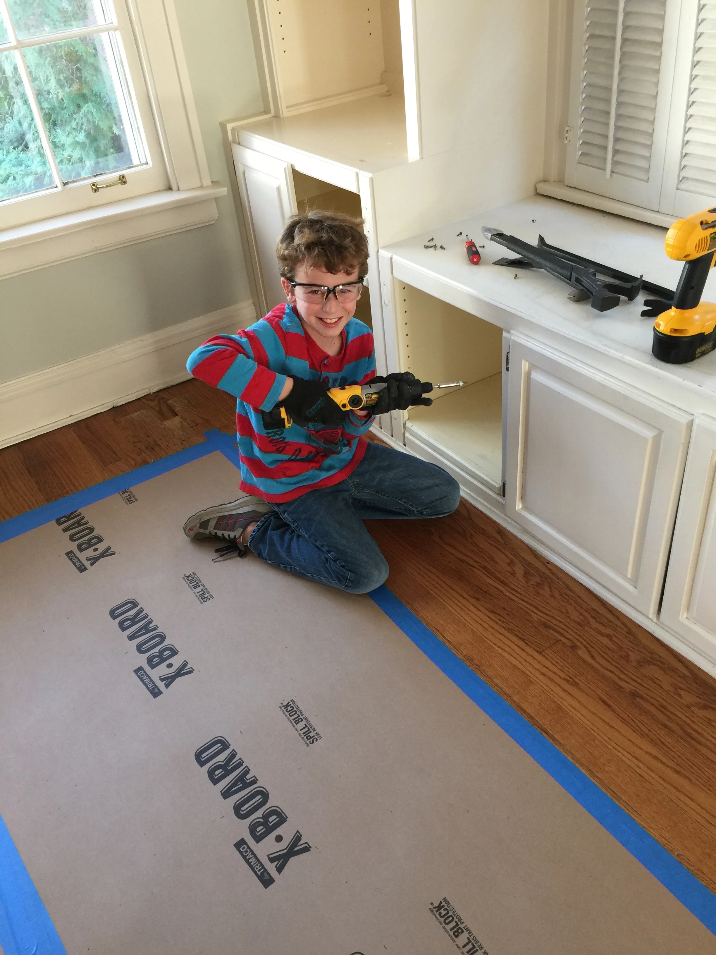 #2 son continuing his work on the many doors in the house.