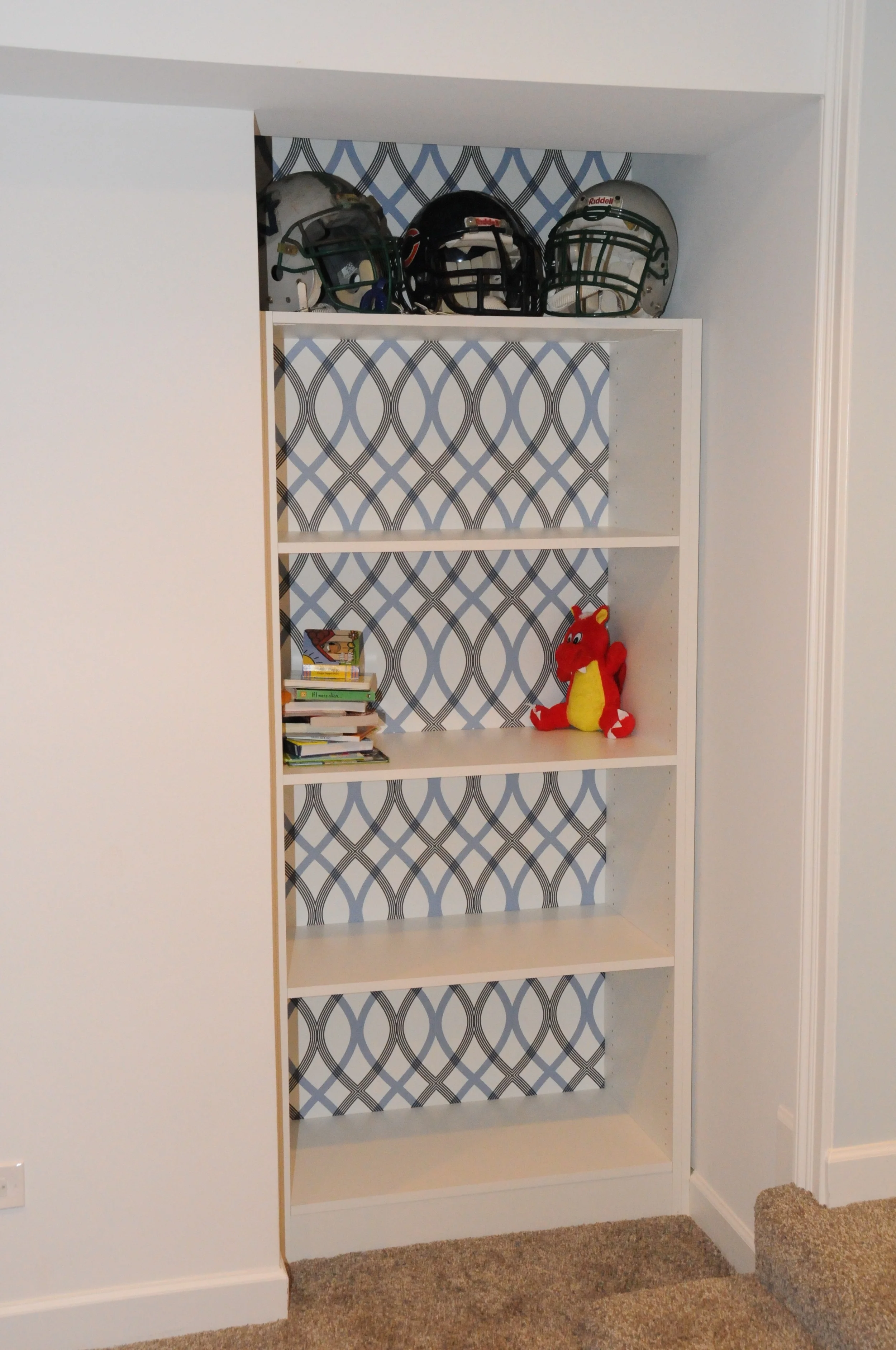 A plush carpet keeps it soft and warm in the playroom. Elsewhere in the basement, we used porcelain tile that looks like wood planks for durability and ease of cleaning. 