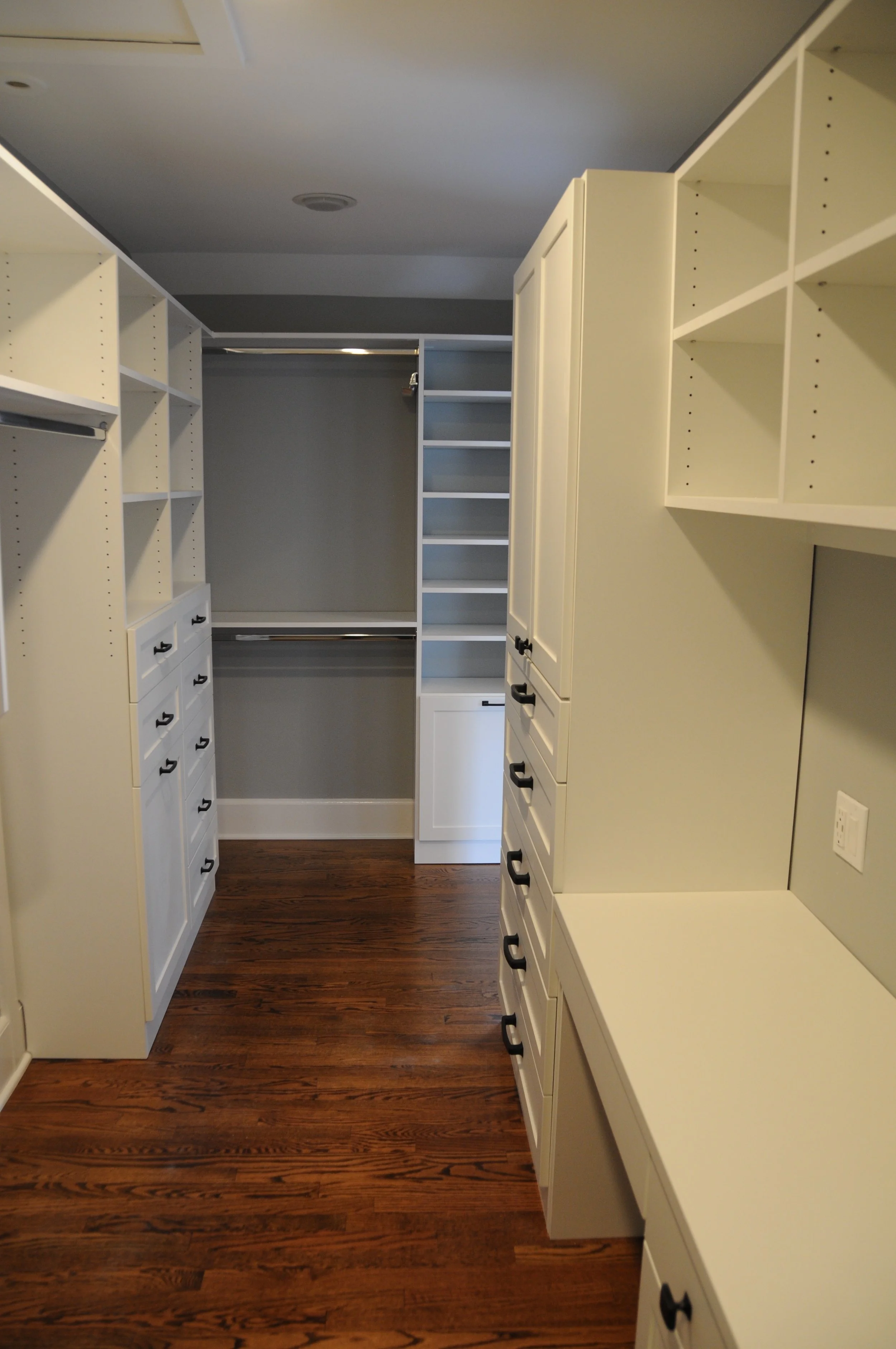 The new closet with built-ins by Perfection Custom Closets includes a desk with under-cabinet lighting. 