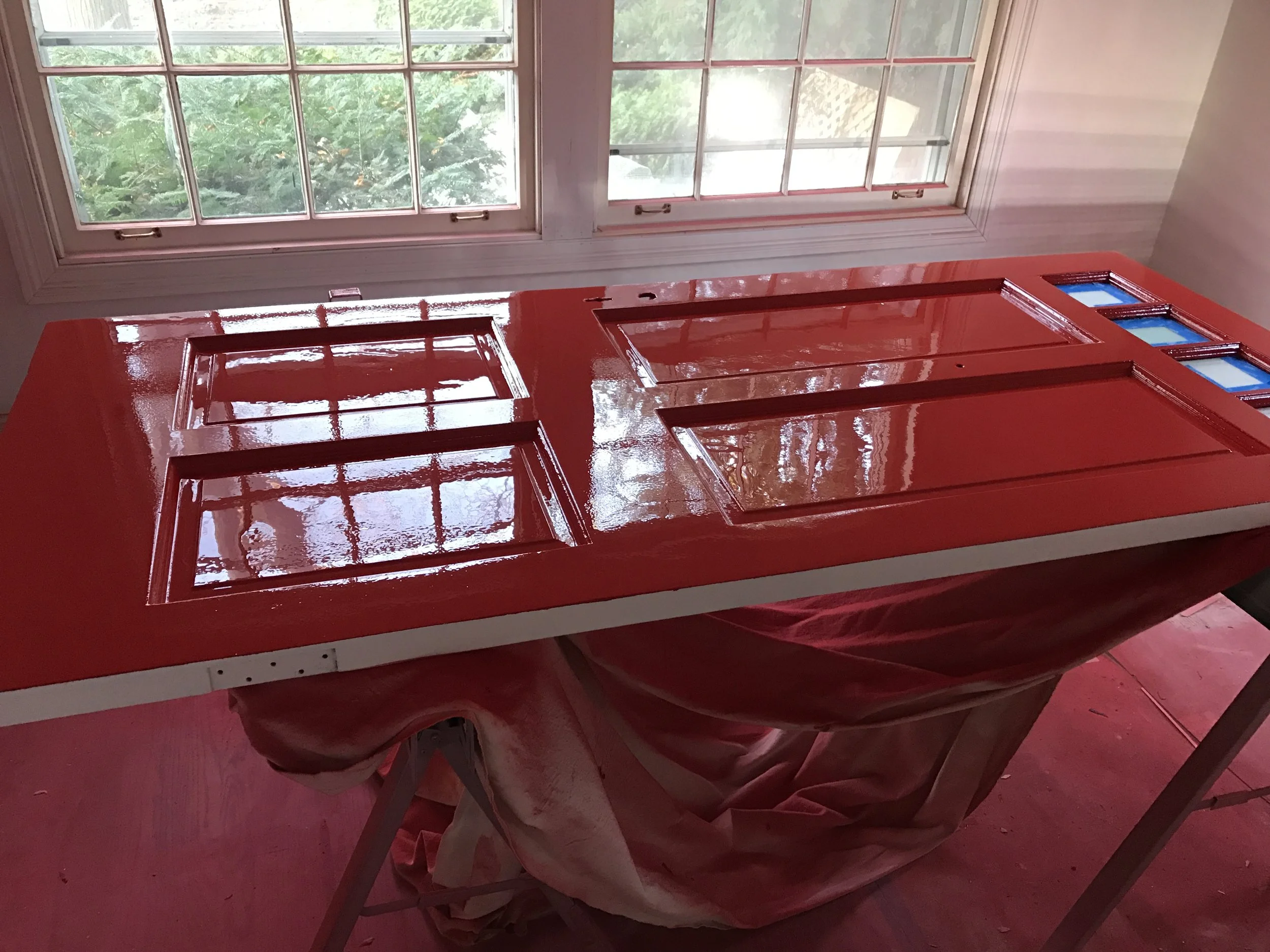 Feast your eyes on the most expensive and labor-intensive door I've ever touched. First black, now fire-engine red. The only way to rationalize this sort of (mis)adventure is to say "art before commerce" and find an adult beverage. Or six. 