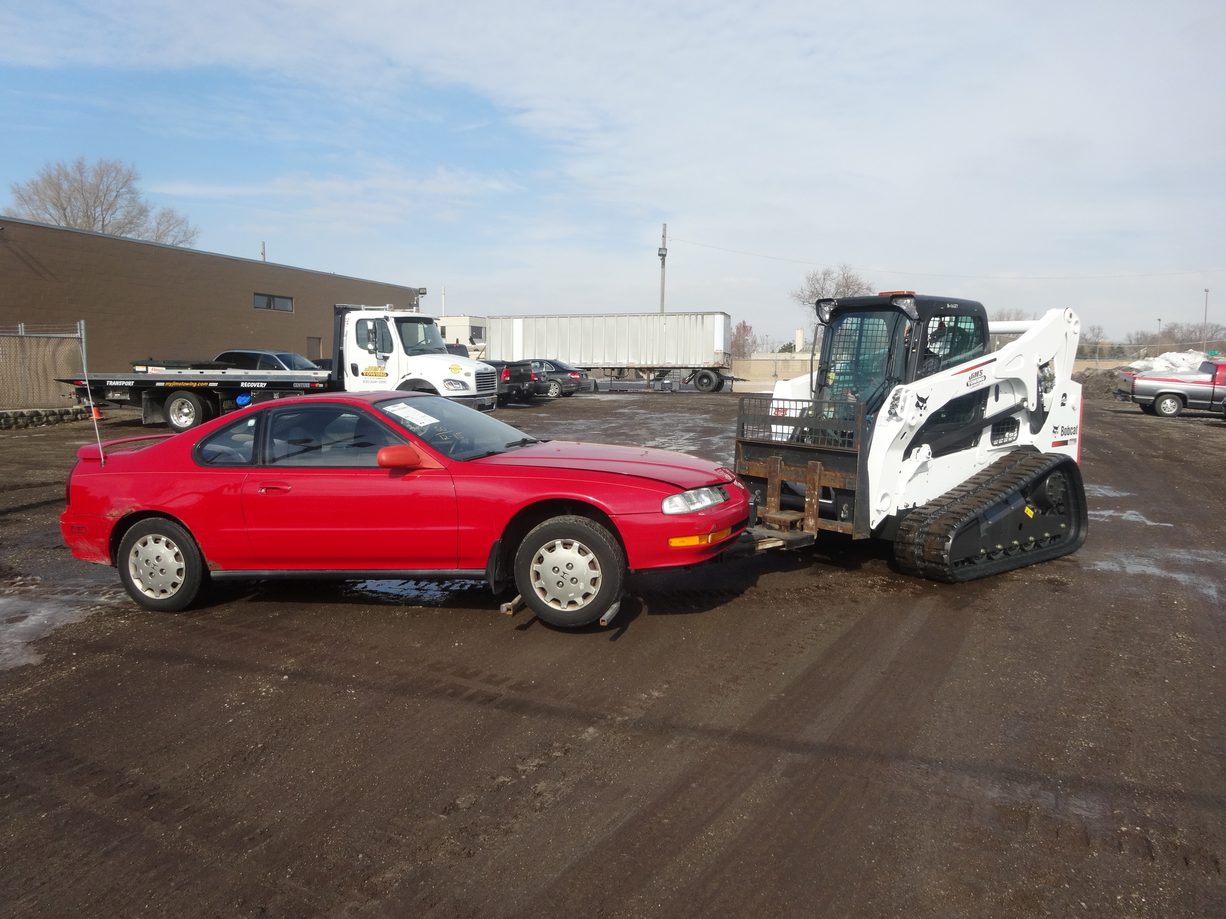 Storage Impound Lot - The wheel lift attachment seen here eliminates any damage while the vehicles are processed into impound.