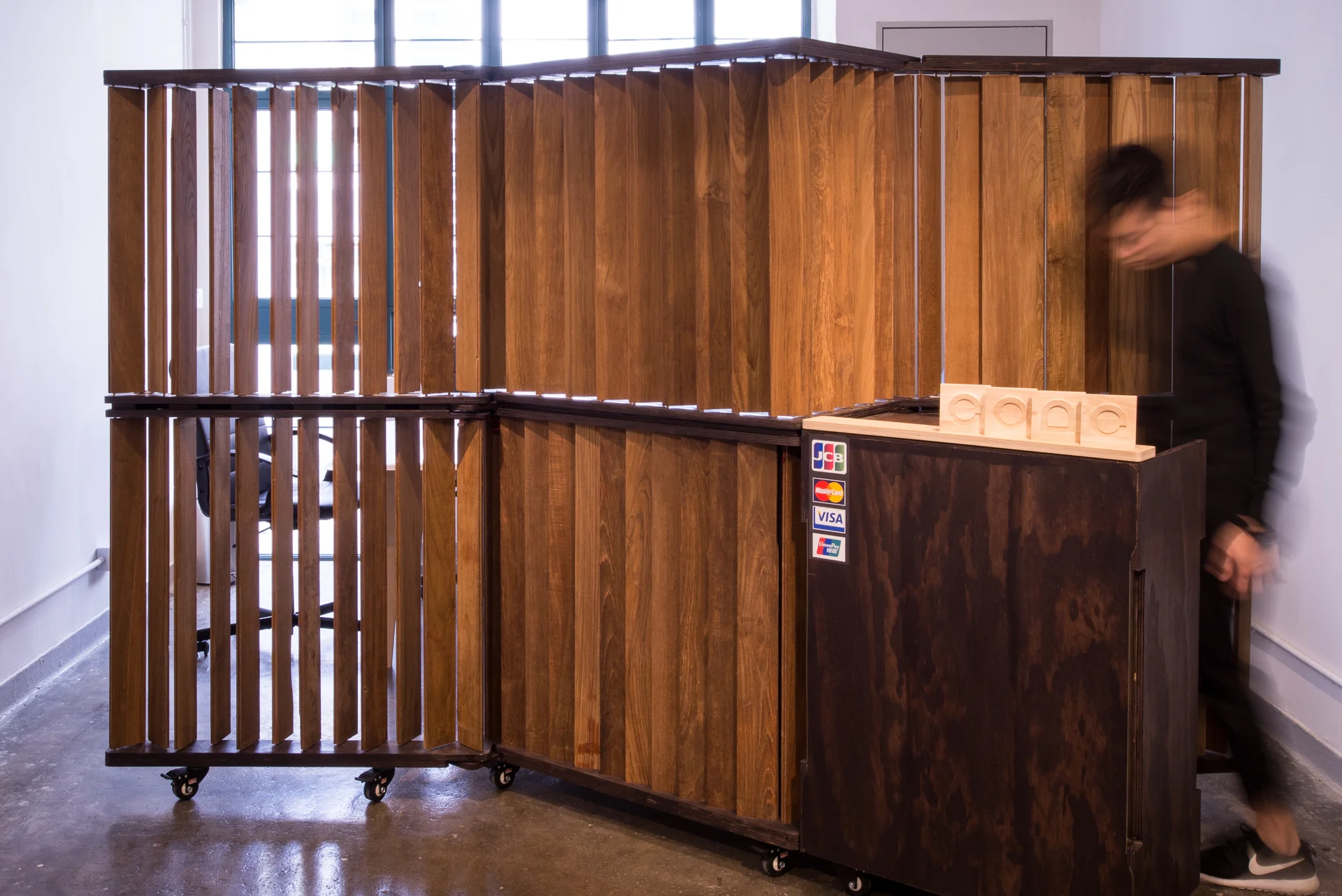 Mobile Folding Screen MFS is an elegant divider that transforms the surrounding spatial quality. The fins are individually rotatable and the whole screen is on wheels. 