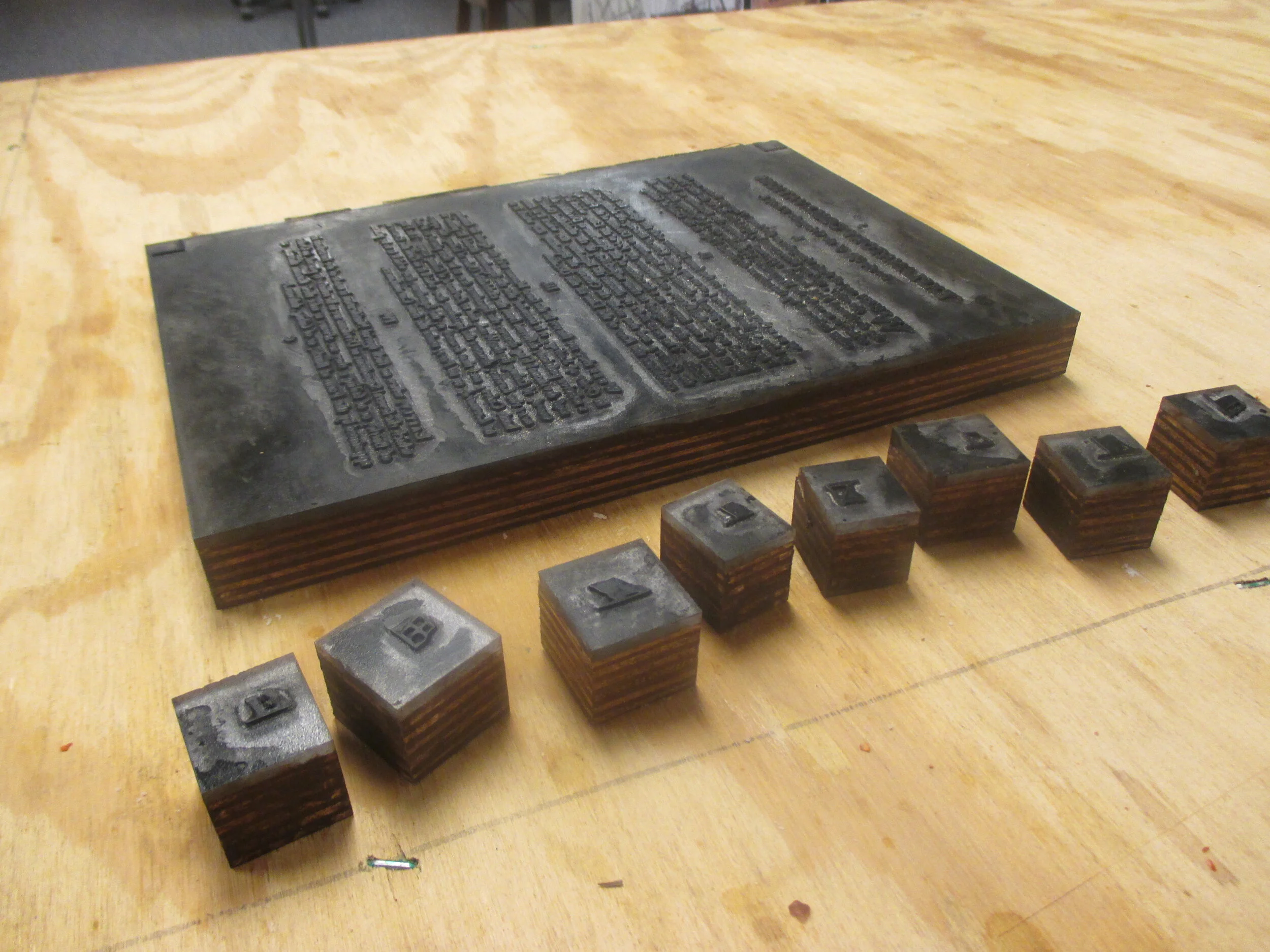  Prop printing plates for the British navy signal book — made from the type of clear plastic that ADA compliant signs are made of, type printed backwards as it would be on the plate. Scenic painters helped me out getting the look of a metallic plate 