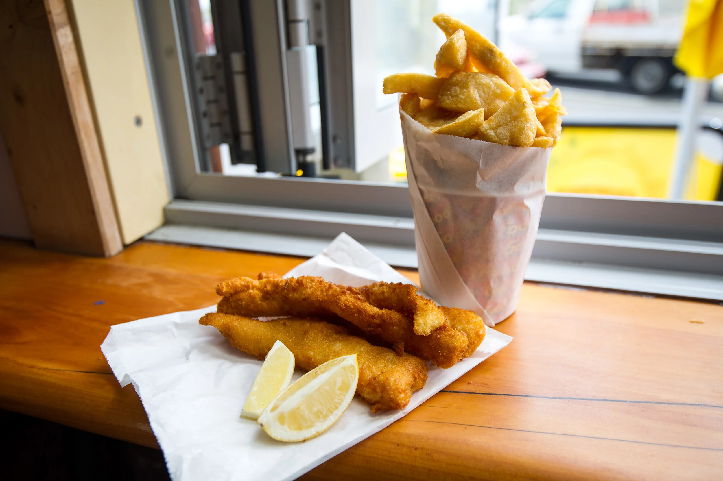 Fish 'n' chips from Blairs on the Beach just off shore at Piha Beach.