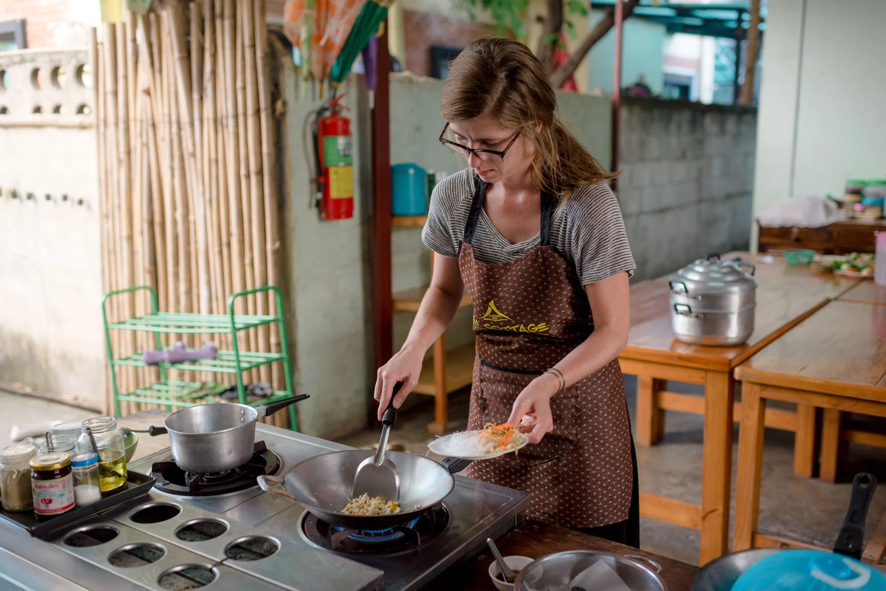 Audrey cooking her second dish: Pad Thai.