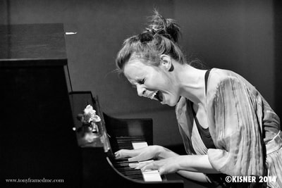 website laura at piano.jpg