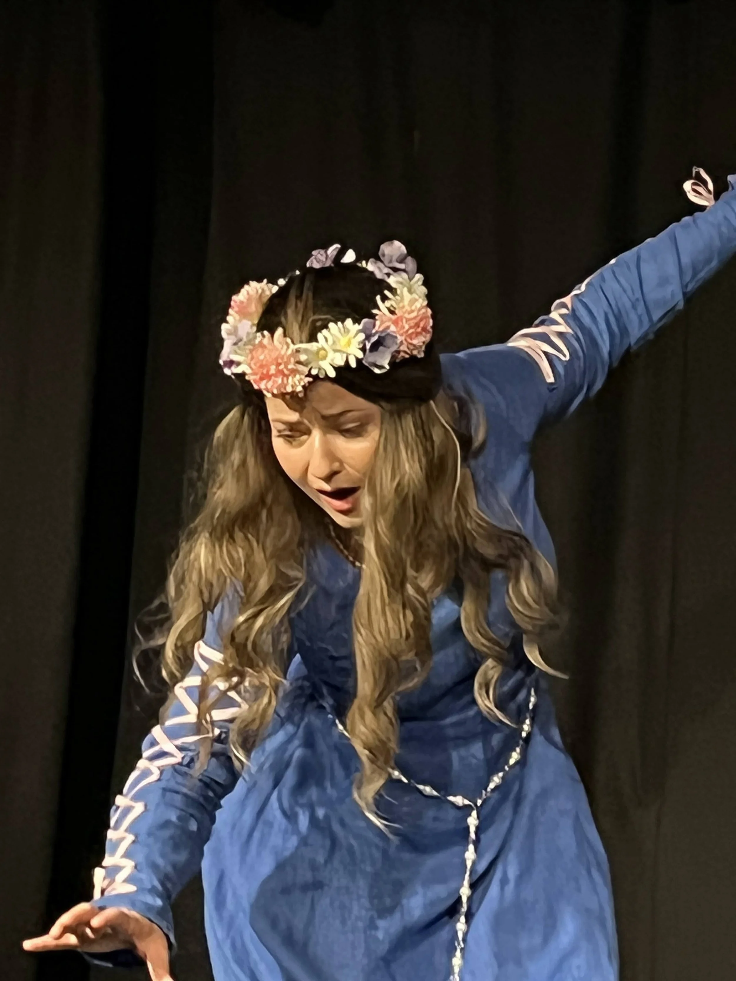 WOMAN IN MEDIEVAL DRESS TRYING TO BALANCE