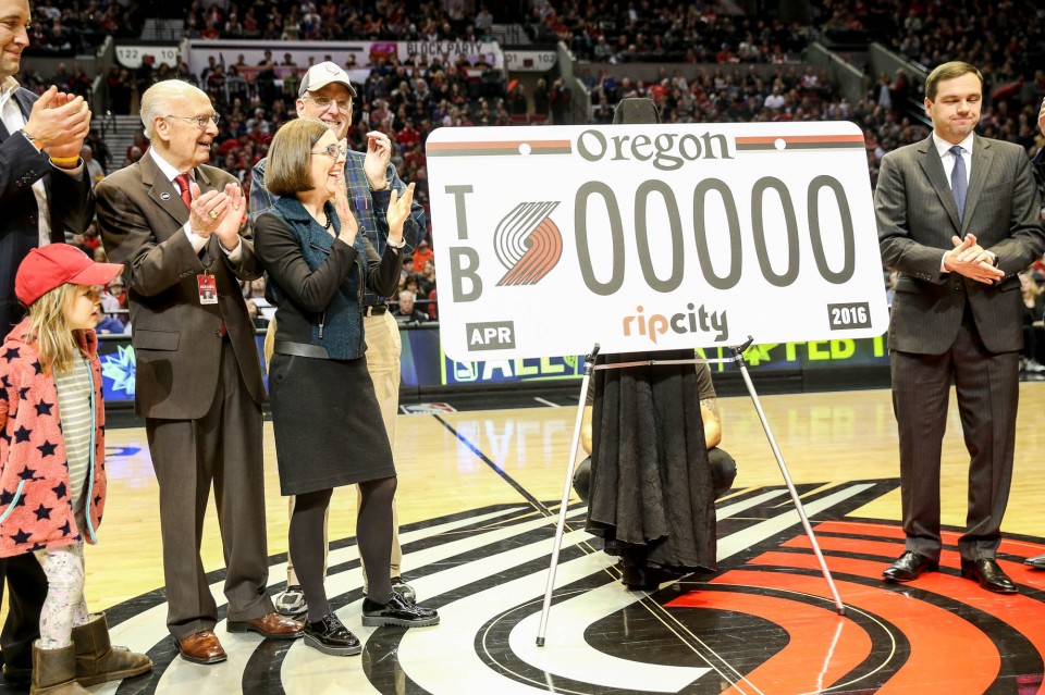 Oregon politicians, including Gov. Kate Brown, unveil the new Portland Trail Blazers license plate during a first quarter timeout against Atlanta Hawks at the Moda Center in Portland, Oregon, January 20, 2016. (Thomas Boyd/The Oregonian)
