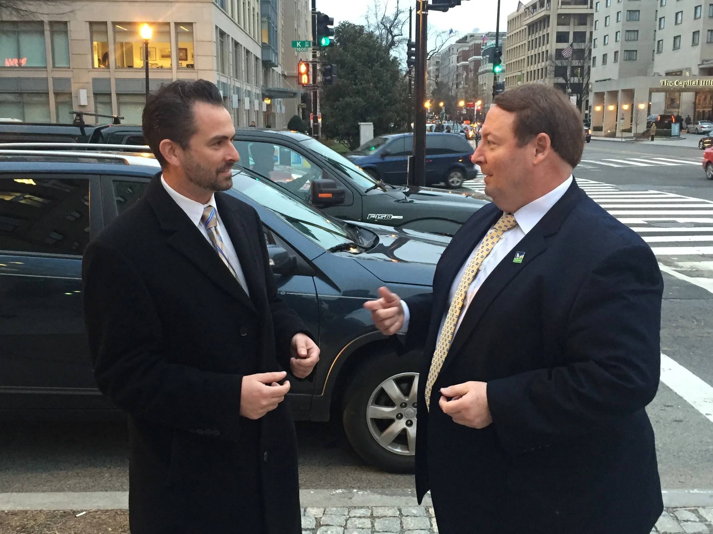 Joel Rubin, left, with Tigard Mayor John Cook, right, discusses federal items highlighted at a recent Conference of Mayors event in Washington, D.C. Rubin, who leads CFM’s federal affairs team, just became the firm’s newest partner.