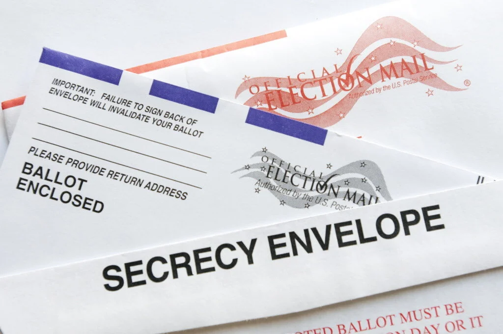 Oregon’s vote-by-mail got its start more than three decades ago because it saved money. Now vote-by-mail may grow in popularity nationwide because it is more secure. Oh yeah, it also boosts voter turnout.