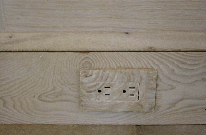  Faux wood outlet to blend existing wood on baseboard. 