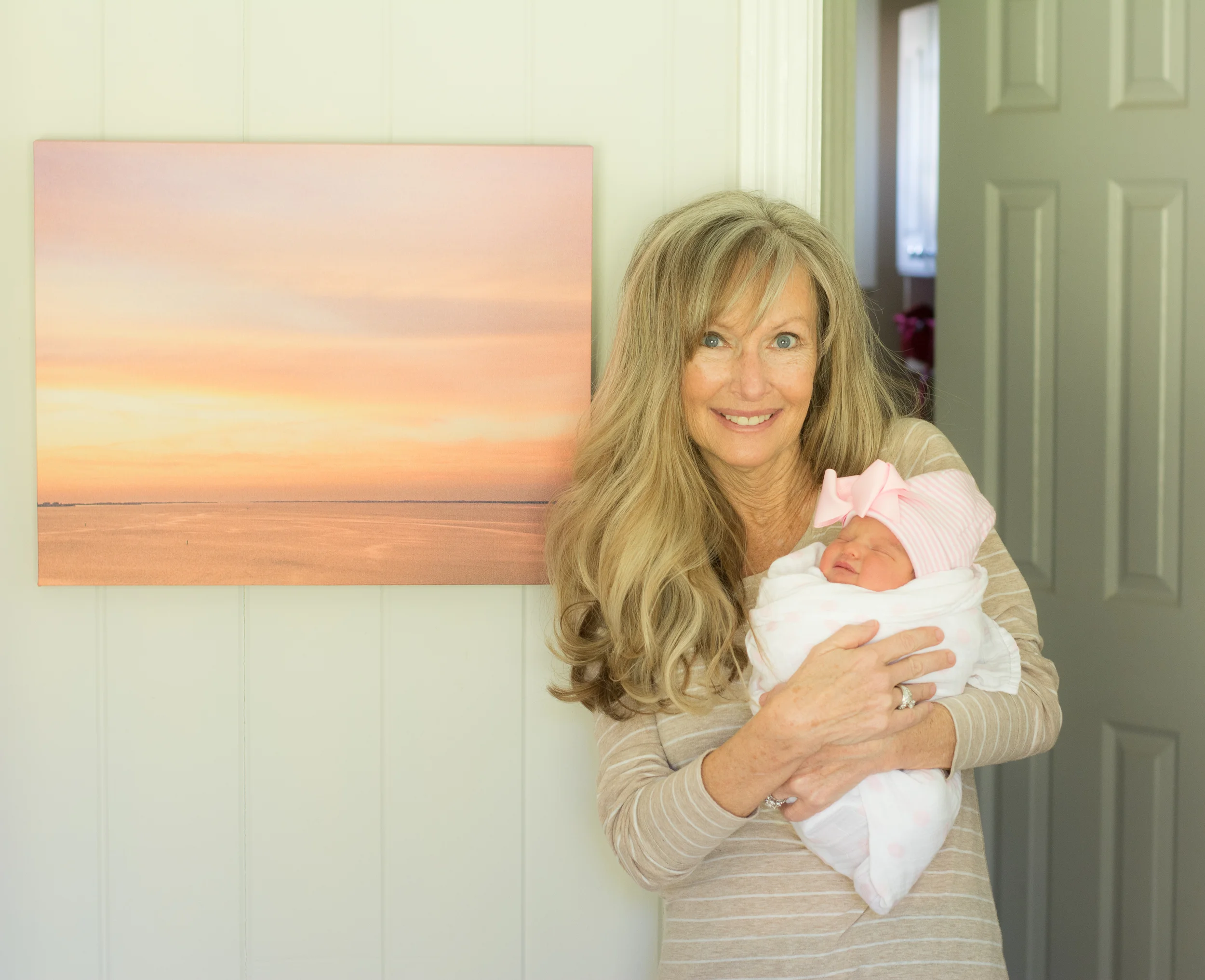 My own grand-bundle next to a pink sunset I captured for her room. She is destined to love the beach!