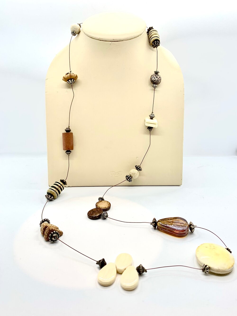 Wooden pearl necklace with golden streaks