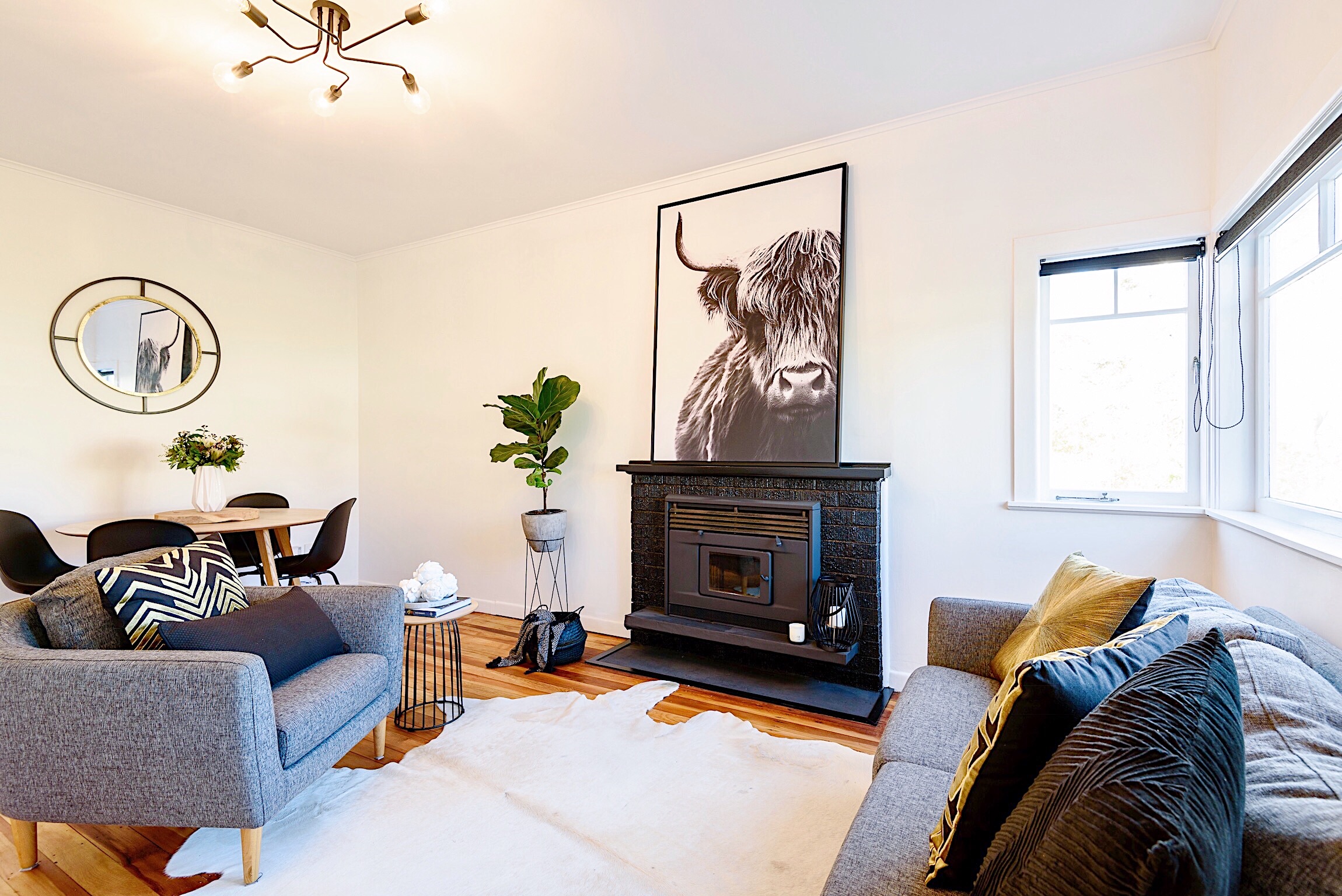 Pearson + Projects The Expert Reveal Lounge Dining Black Fireplace Cow print.jpg