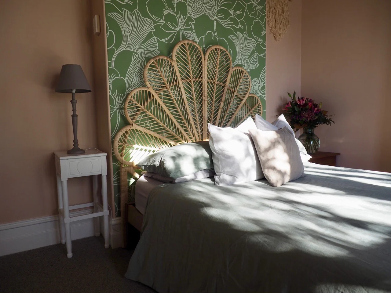 Charmer in Alexandra Master Bedroom Wallpaper Pink Green Pearl Drapes Rattan Pendant Sage Green Linen Lounger - 10.jpg