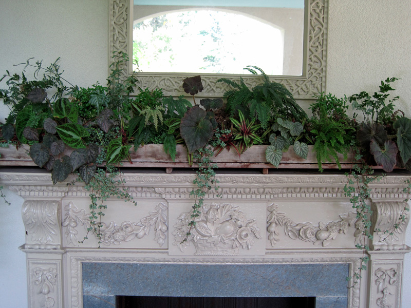 A grand display on the mantel of a porch fireplace!