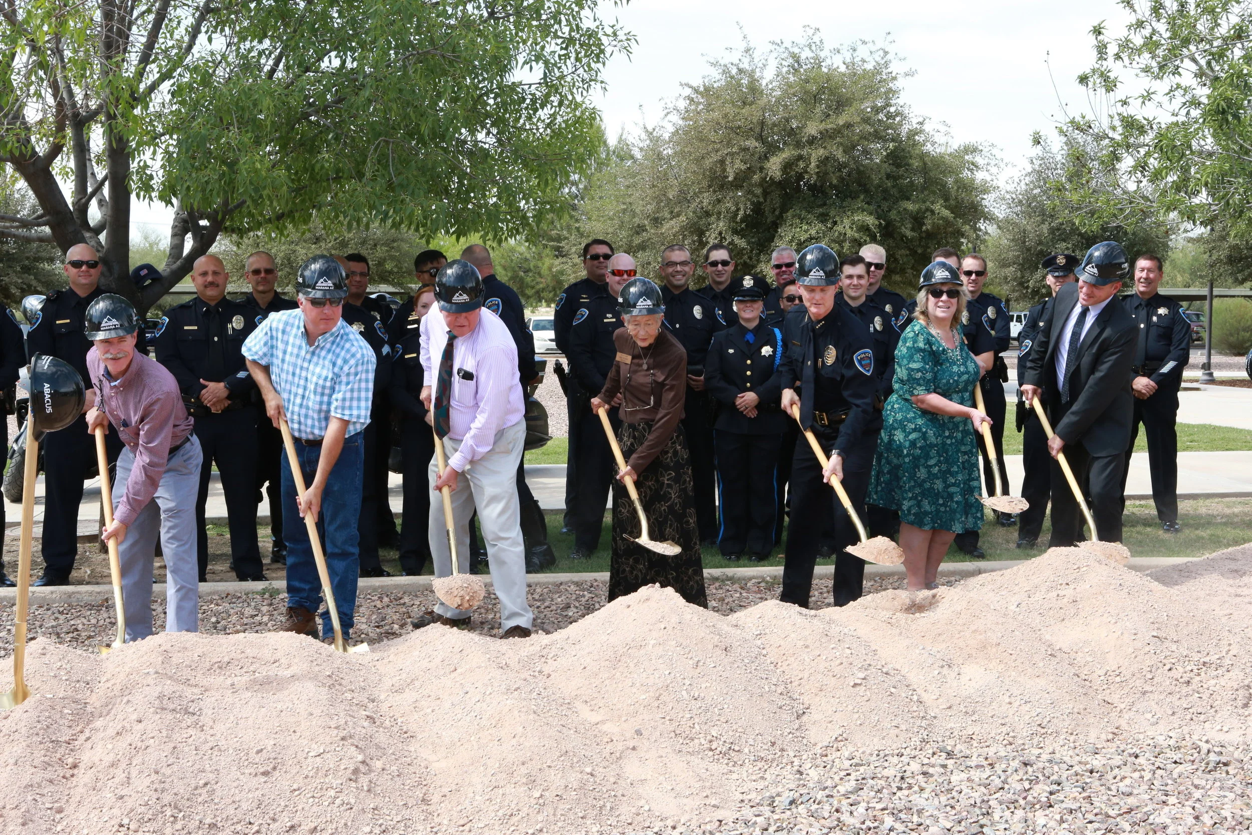 Left to right: Councilmember Bowen, Vice Mayor Post, Mayor Honea, Councilmember McGorray, Police Chief Rozema, Councilmember Comerford, and Town Manager Gilbert Davidson break ground for the new police facility.