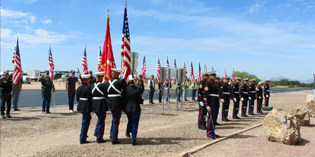 A Marine color guard participates in the ceremony to honor those who perished in the April 8, 2000 crash of a MV-22 Osprey Tilt rotor aircraft at the Marana Regional Airport.