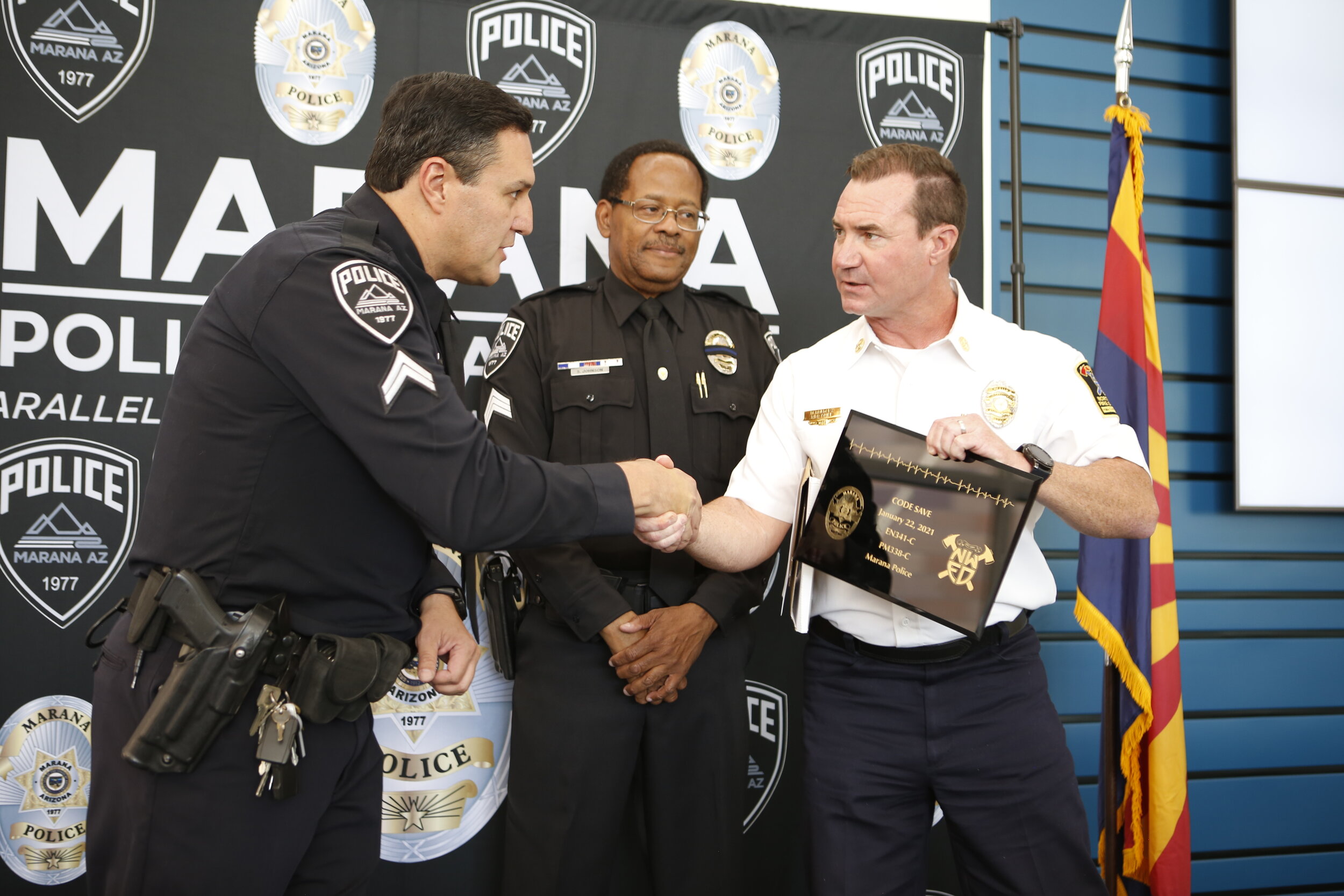  Northwest Fire presented Officer Cabrera (left) and Sergeant Johnson (center) with a plaque for the Lifesaving Award 
