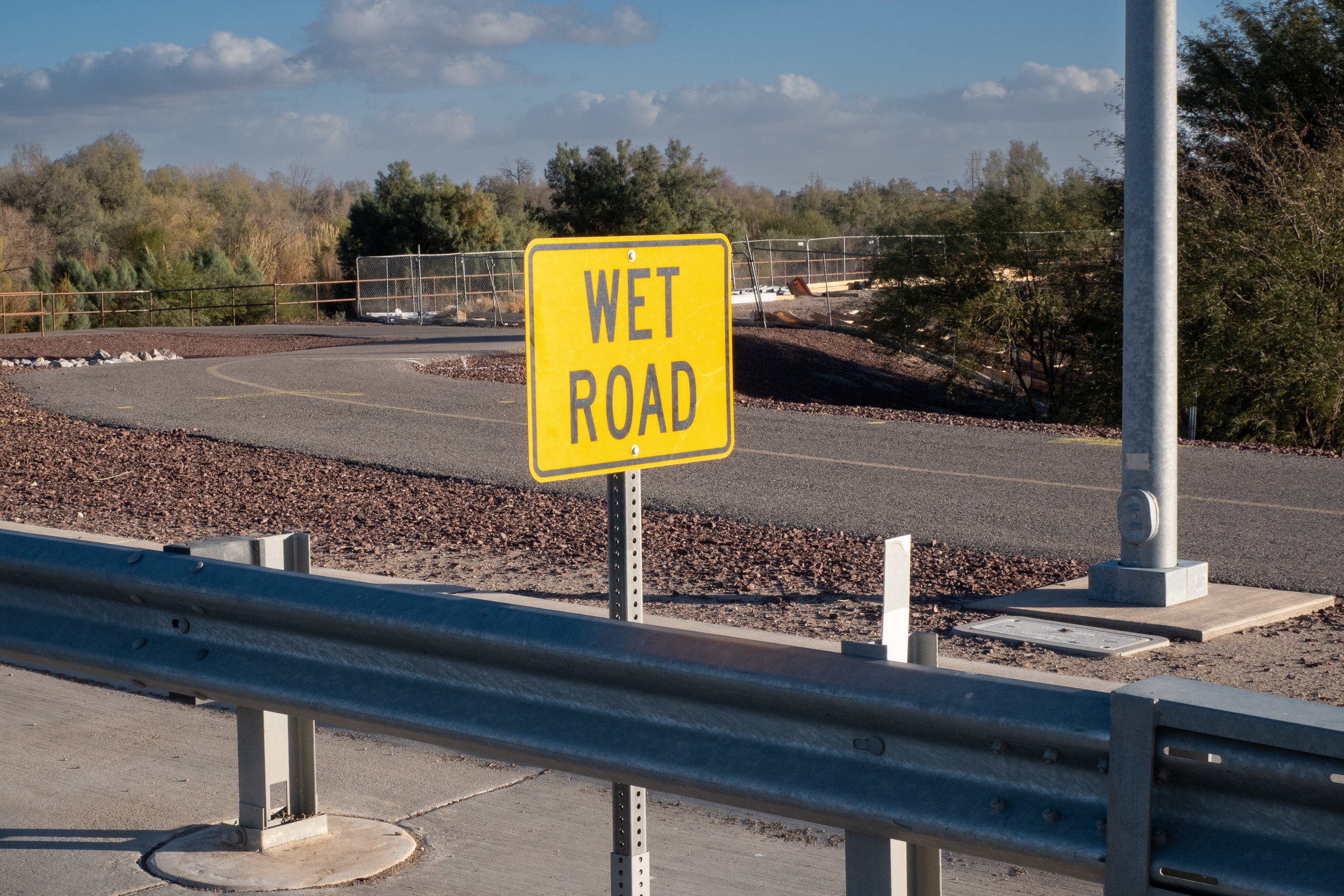 Wet Road ahead sign