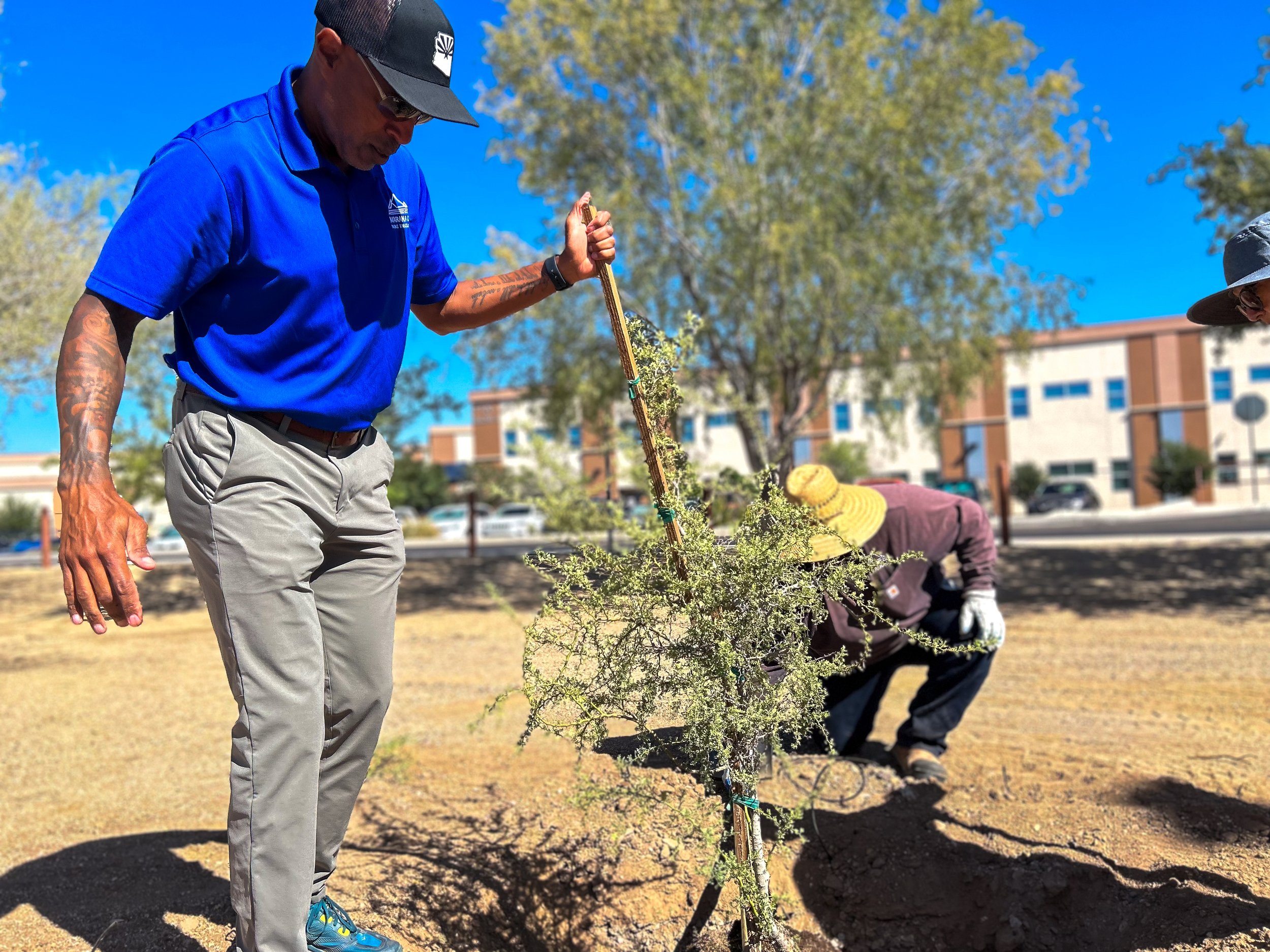 Deputy Director Wayne Barnett helping plant trees