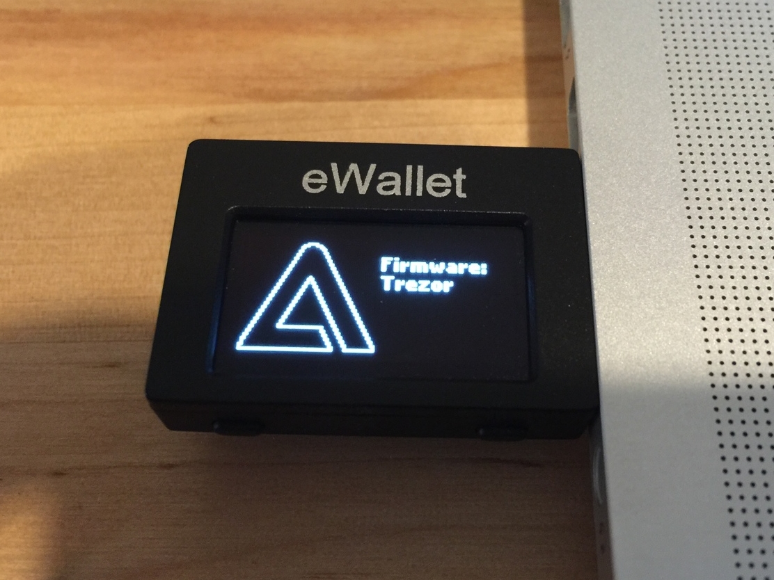 Bootloader appears to check and affirm Trezor-signed firmware images. The button mappings are correct.