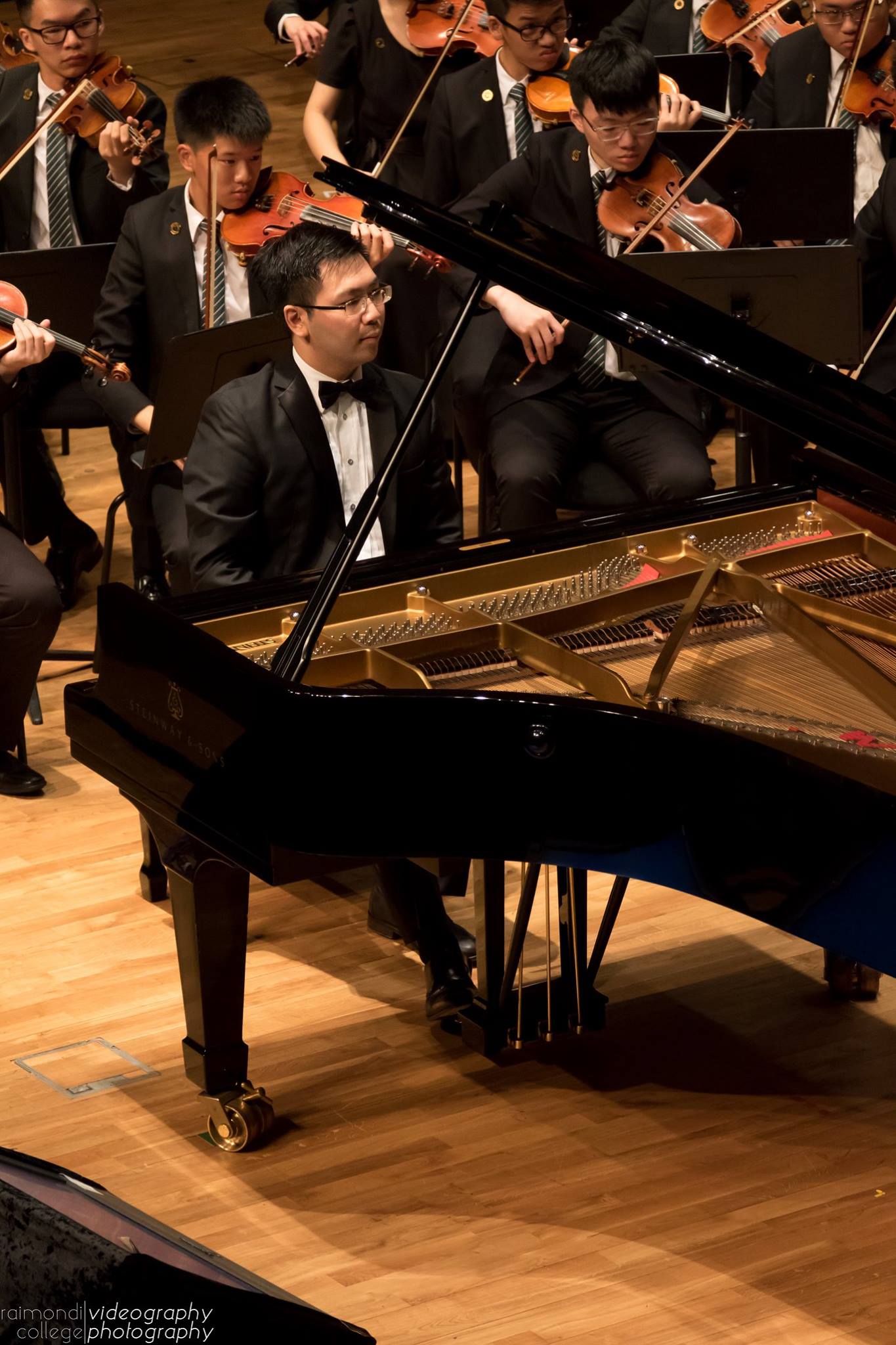 Siu Hei performing Edvard Grieg's Piano Concerto in A minor with the Raimondi College Orchestra in the Hong Kong City Hall Concert Hall, Hong Kong.