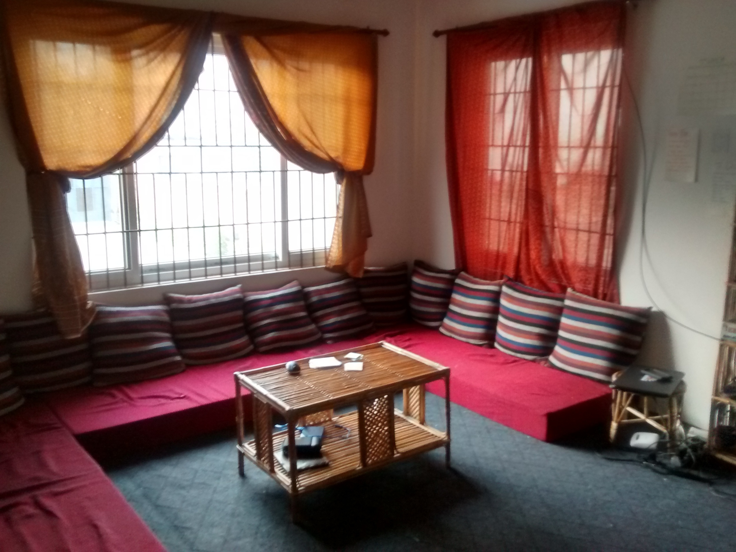 This is the living room. We started looking for a couch when we got here and found that "pre-made" furniture is really expensive. Instead, we had this floor couch made. It's super comfy :)