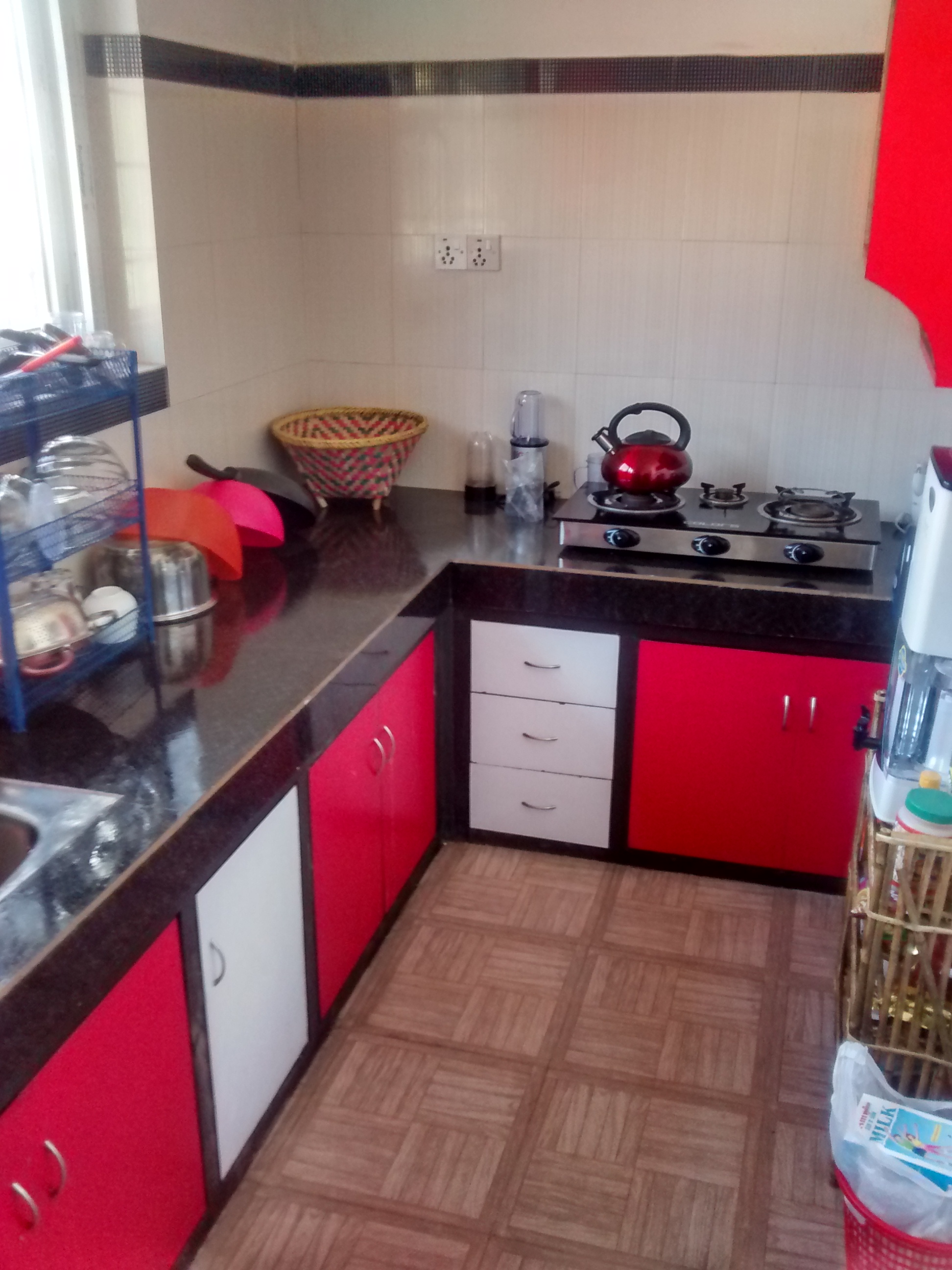 This is the kitchen. Its cute:) The countertops ARE as short as they look, they are a little shorter than hip level. The stovetop is hooked to a propane tank in the cabinet below. We can't drink the tap water here (many locals don't either) so we have a water filter on the right hand side.