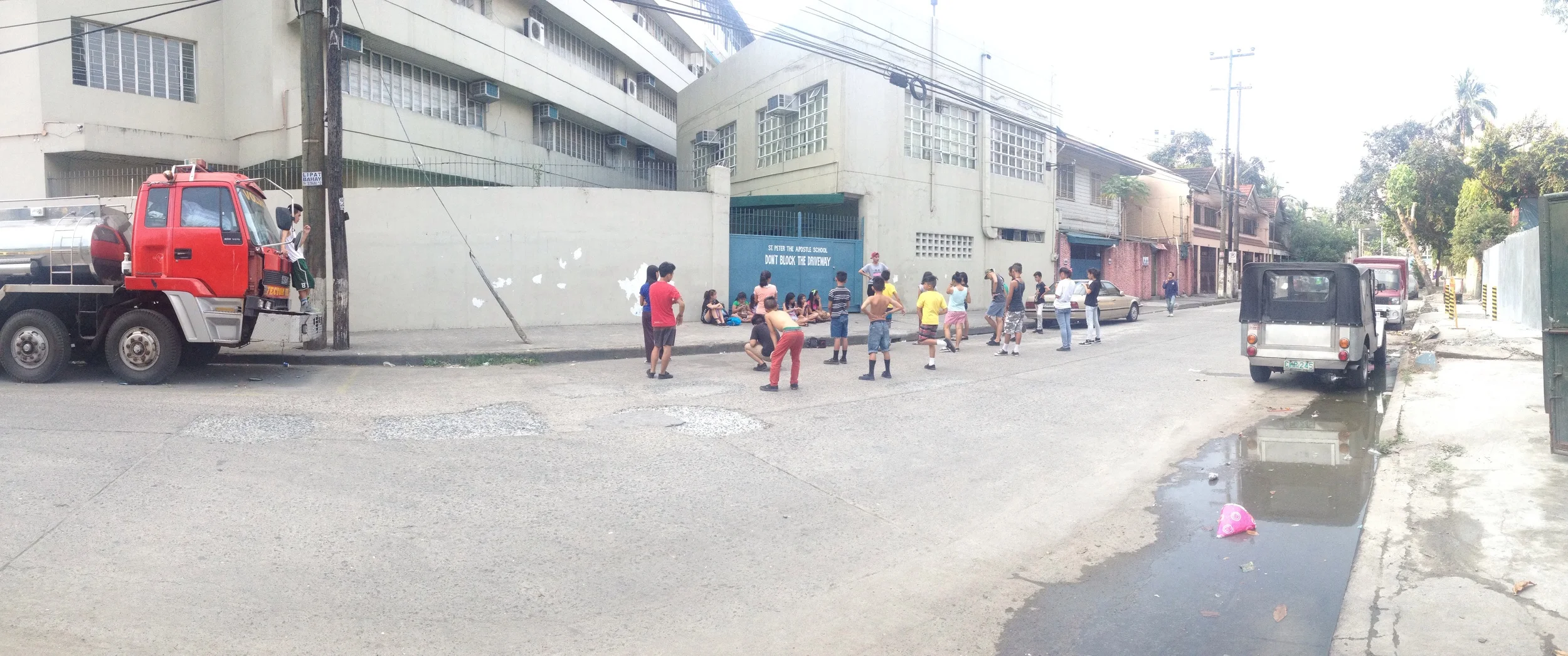 Students and neighborhood kids gather at this spot daily to practice dance routines and can still be found here at midnight. Different groups practice at different times, and I wonder how they arrange the use of this space. Often the scene attracts others who hang out on the fire trucks, side walk, or on their bikes. 