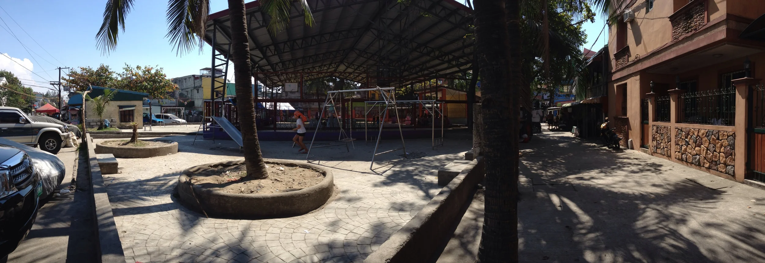From left to right: barangay hall, basketball court, playground, general open space 