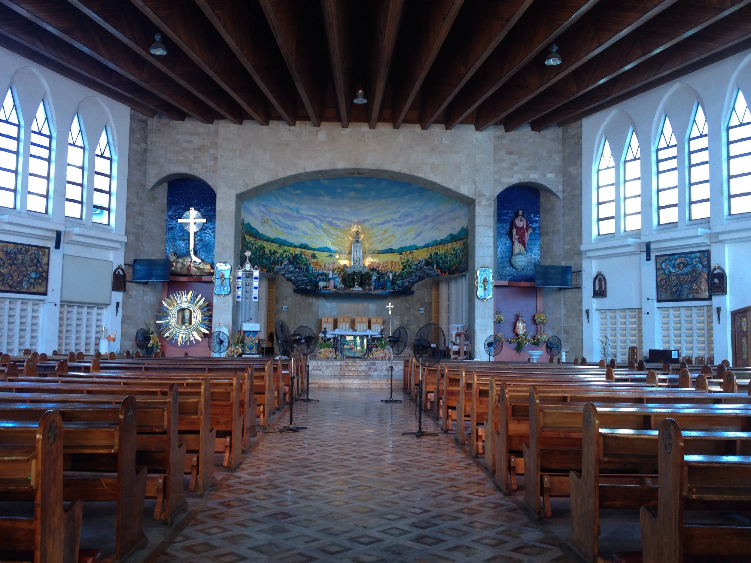 The National Shrine of Our Lady Fatima built in 1965 is my kind of church- colorful mosaics, marble tiled floors, wood details, and geometric glass. The statue was held up by Enrile and Ramos during the EDSA Revolution and was a well known image of the struggle during that time. 