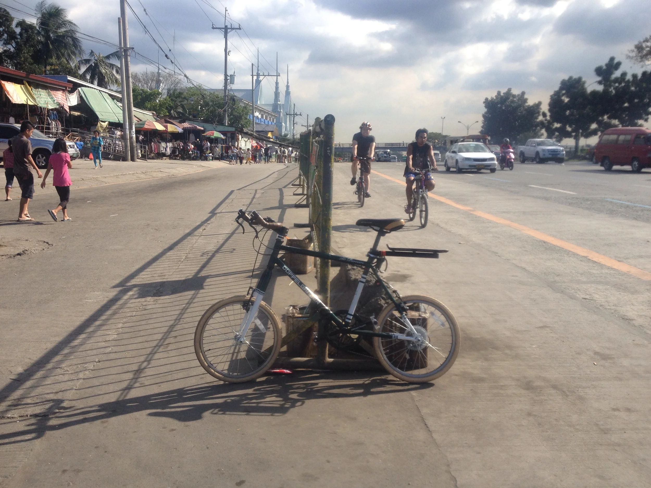 This barrier for a jeepney terminal provides an example of what a protected bike lane along commonwealth could look like. Even during a low traffic period it is still terrifying to be on the roadway as a biker.