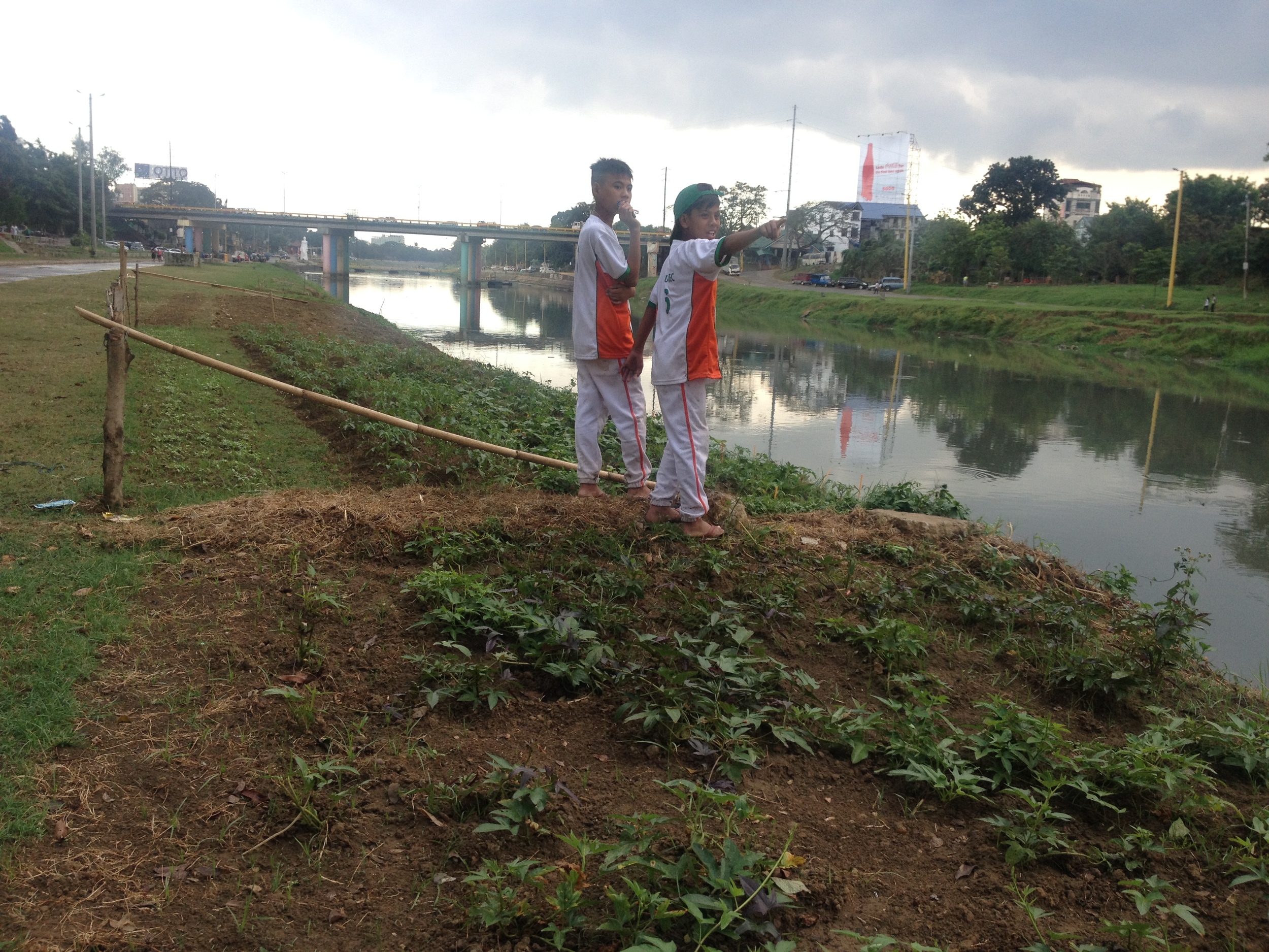 5th grade baseball players from South Caloocan admiring the river after their 9-5 win. The team is so far undefeated this season. The boys pointed excitedly to people fishing down the river. It was endearing to see their sense of fascination with the river. 