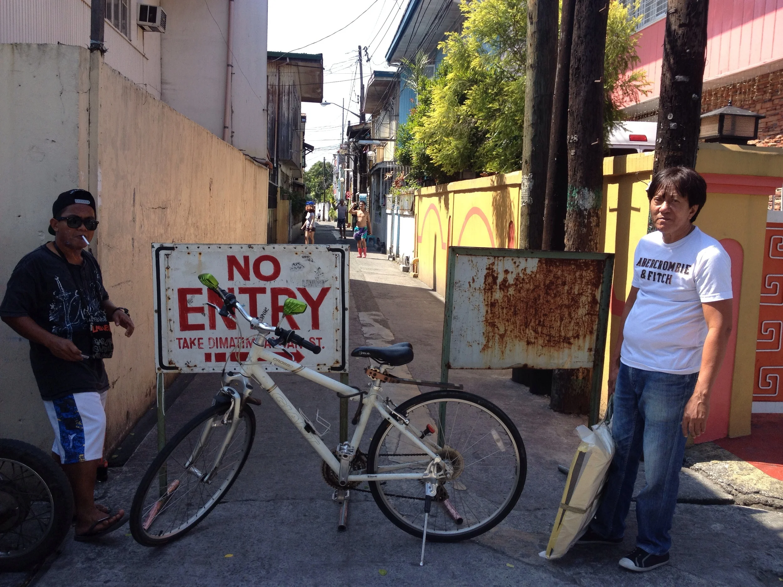 Cars can only pass this street if they are a resident parking- or if you have a sticker from the Barangay...