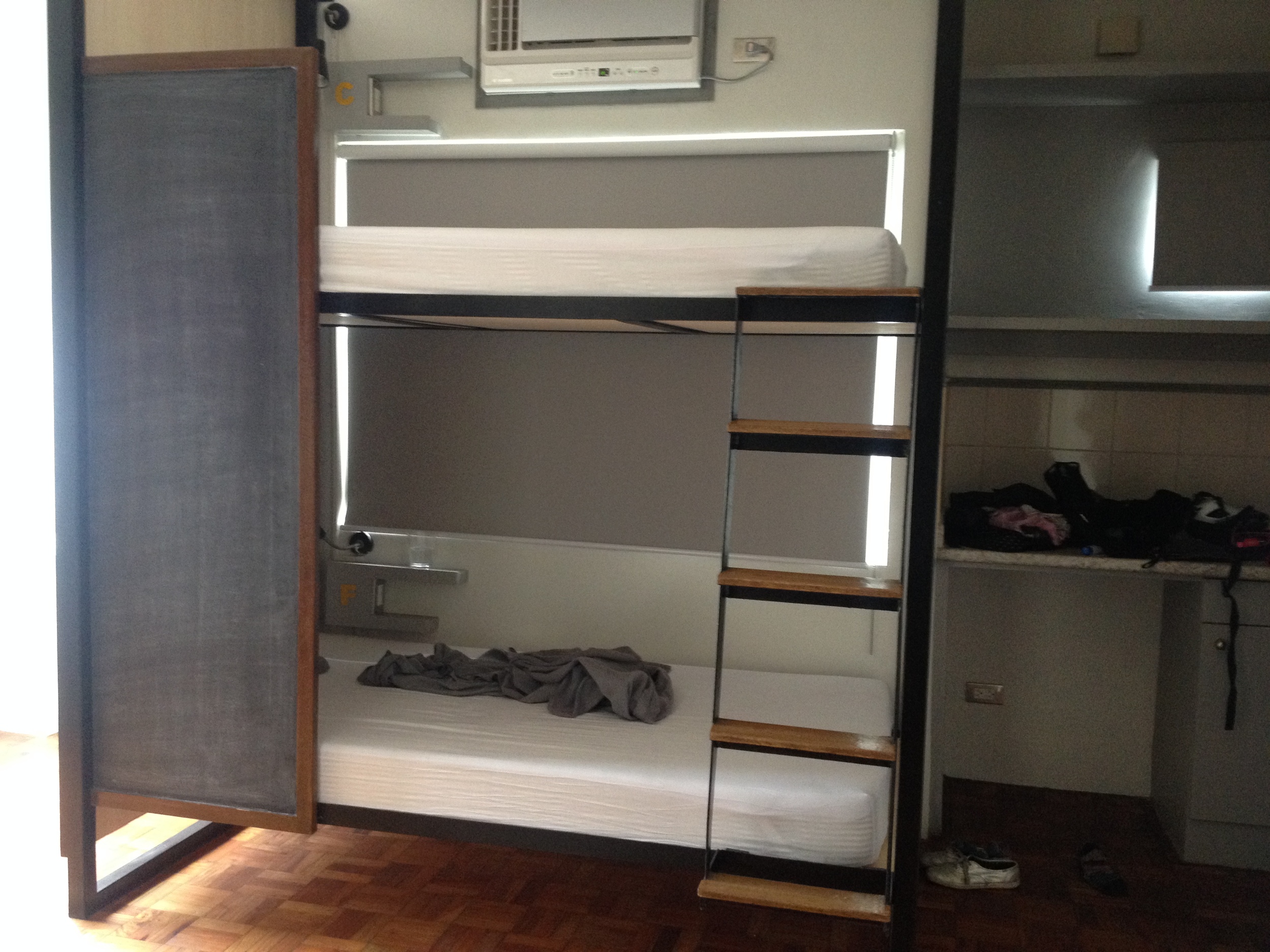 The bed was super spacious and comfortable. It has a bedside light, plug, and shelf. There were six beds in a large room, but the mini divider makes you feel like you have some privacy. 