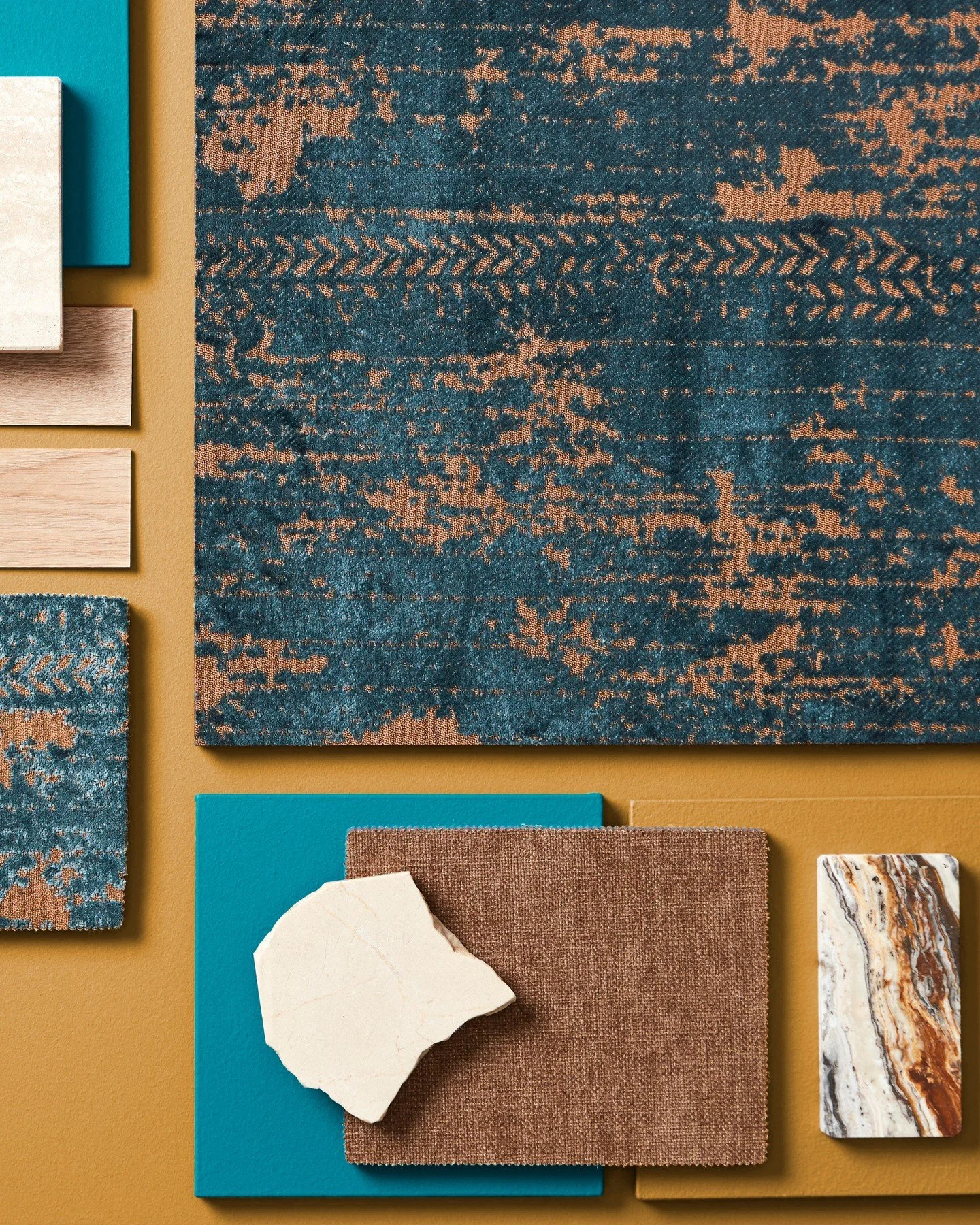 A bold balance of contrast and cohesion. Deep teal, warm ochre, and rusted copper tones meet textured textiles, natural stone, and wood grains. A visual study in how cool depth and earthy warmth can coexist—inviting, grounded, and expressive.