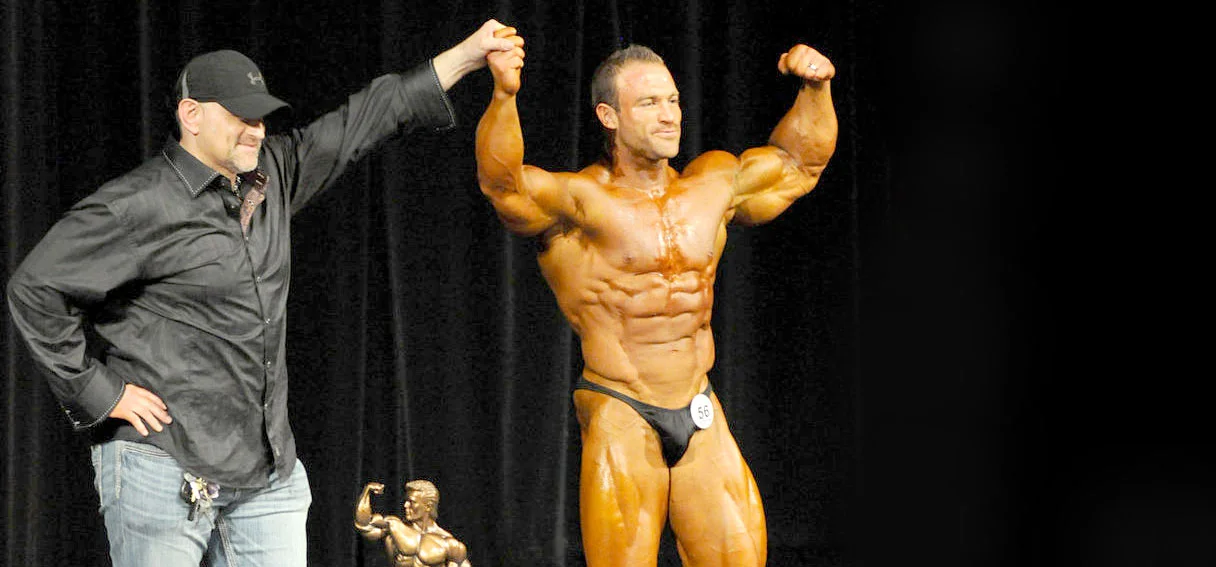 Mike presenting the Overall Award to the 2014 NPC Grand Rapids Open Champion.