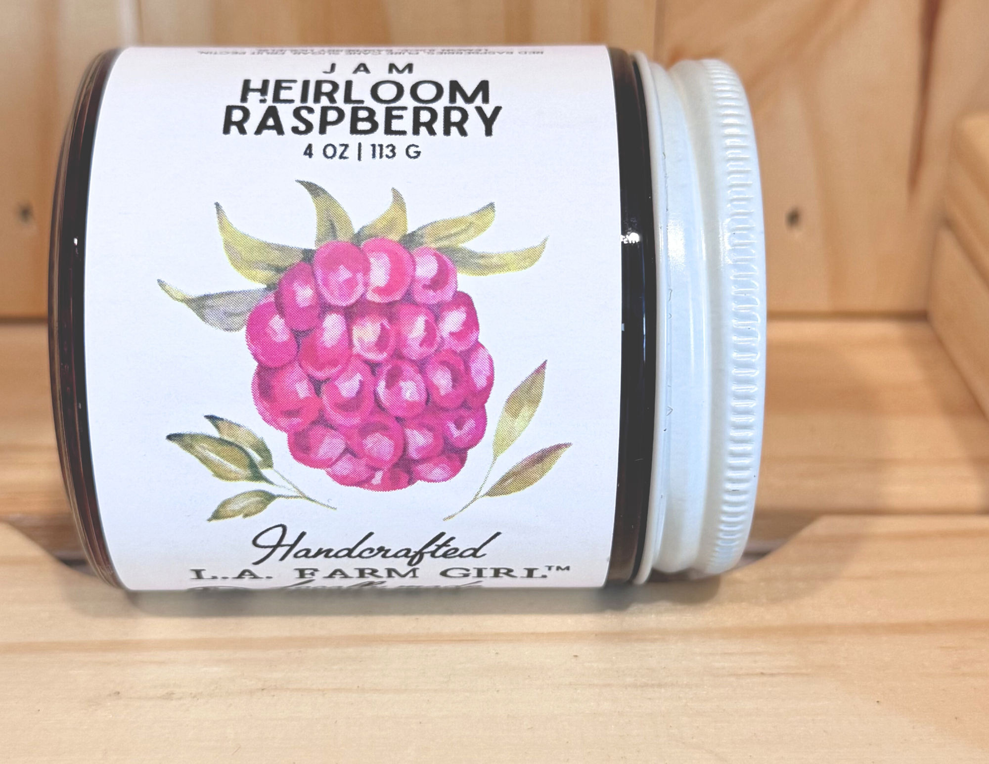 Close-up of Heirloom Raspberry small-batch Texas jam label.