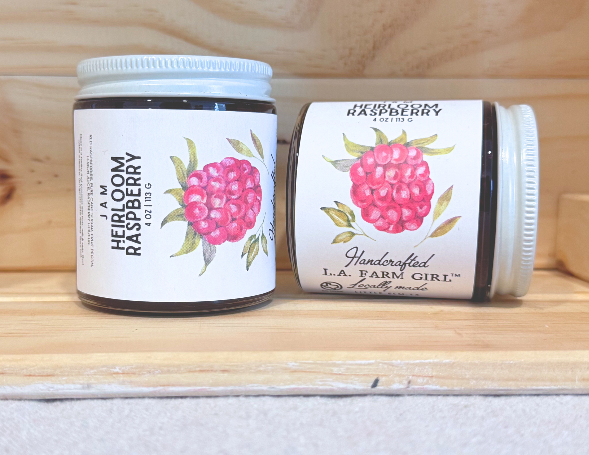 Heirloom Raspberry jam jar with bright raspberry artwork.