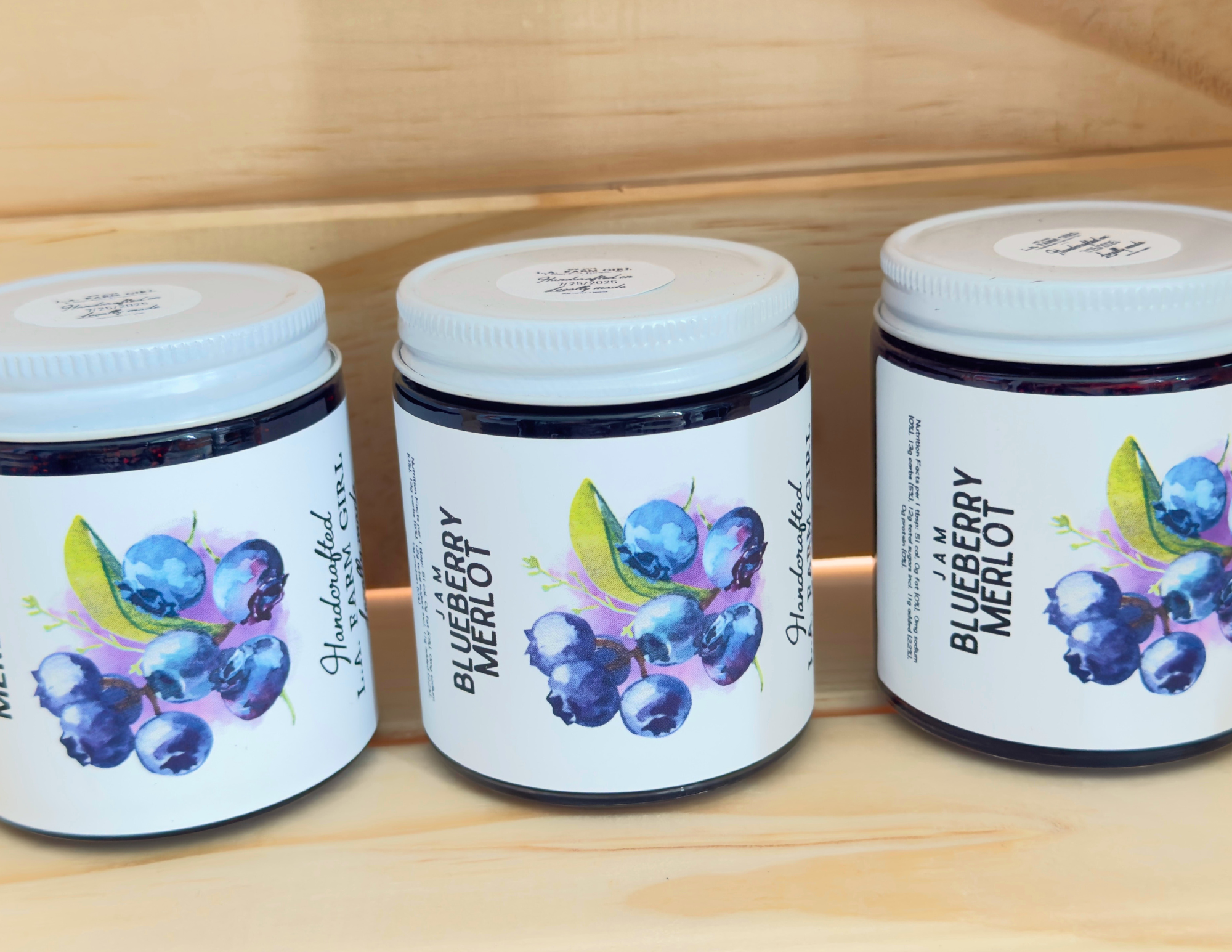 Blueberry Merlot jam jar with blueberry illustration on label.